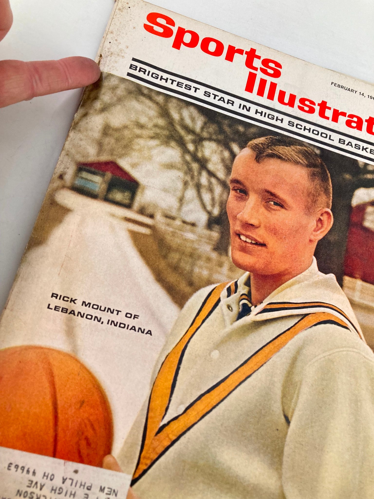 Close-up view of the Vintage Sports Illustrated magazine cover from February 14, 1966, highlighting Rick Mount of Lebanon, Indiana, with details of the basketball and magazine wear.