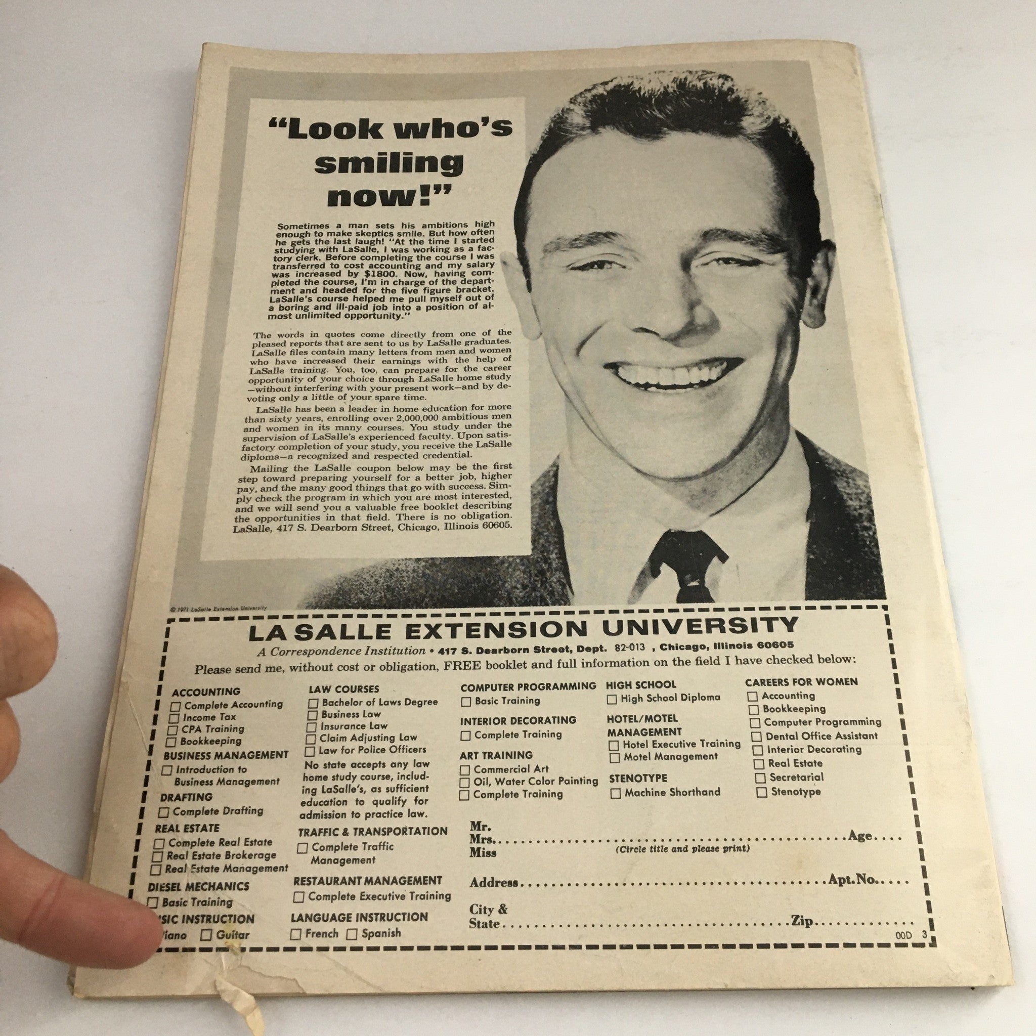 Back cover of Hit Parader Magazine October 1972 featuring a vintage advertisement for La Salle Extension University with a smiling man. The ad highlights various courses and training programs available, showcasing classic design elements from the era.