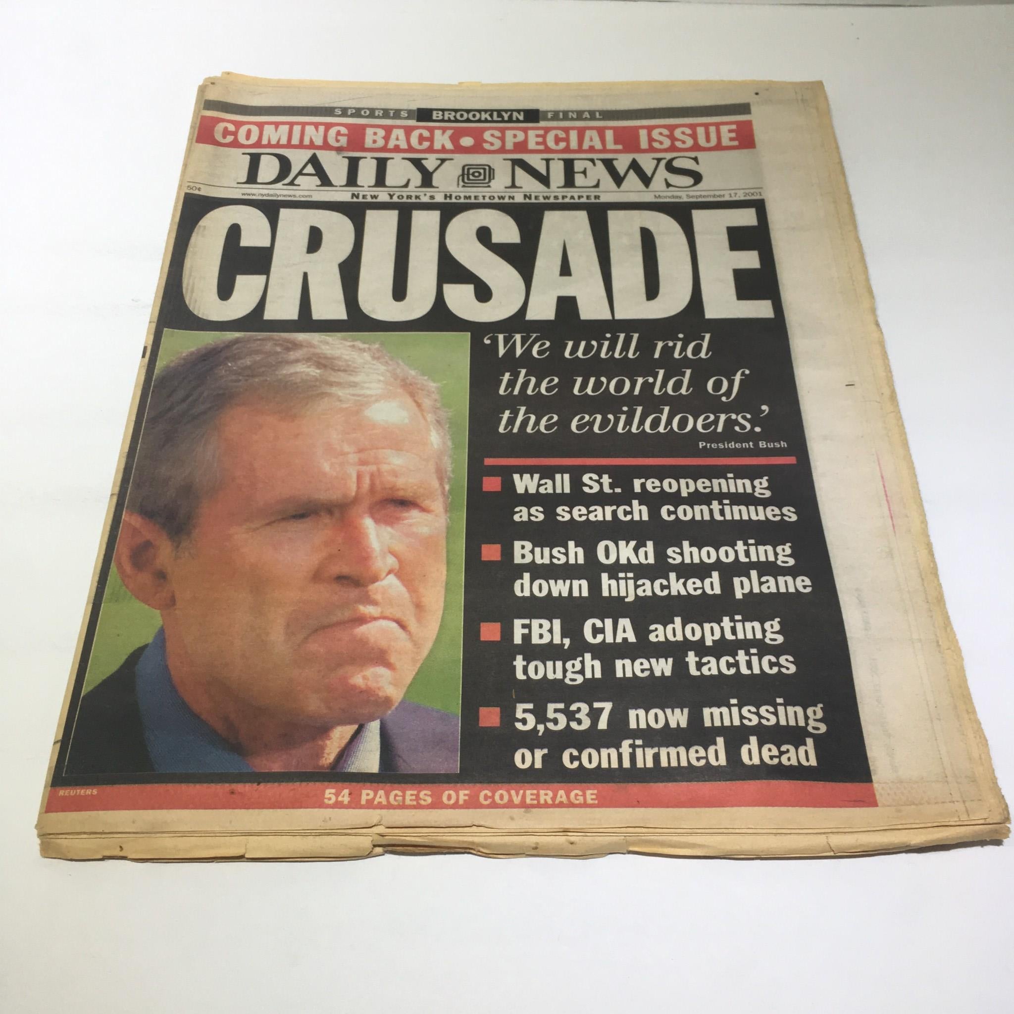 NY Daily News front page from September 17, 2001, featuring President Bush's statement 'We will rid the world of the evildoers' in bold. Includes details on Wall Street reopening and the aftermath of a hijacked plane incident.