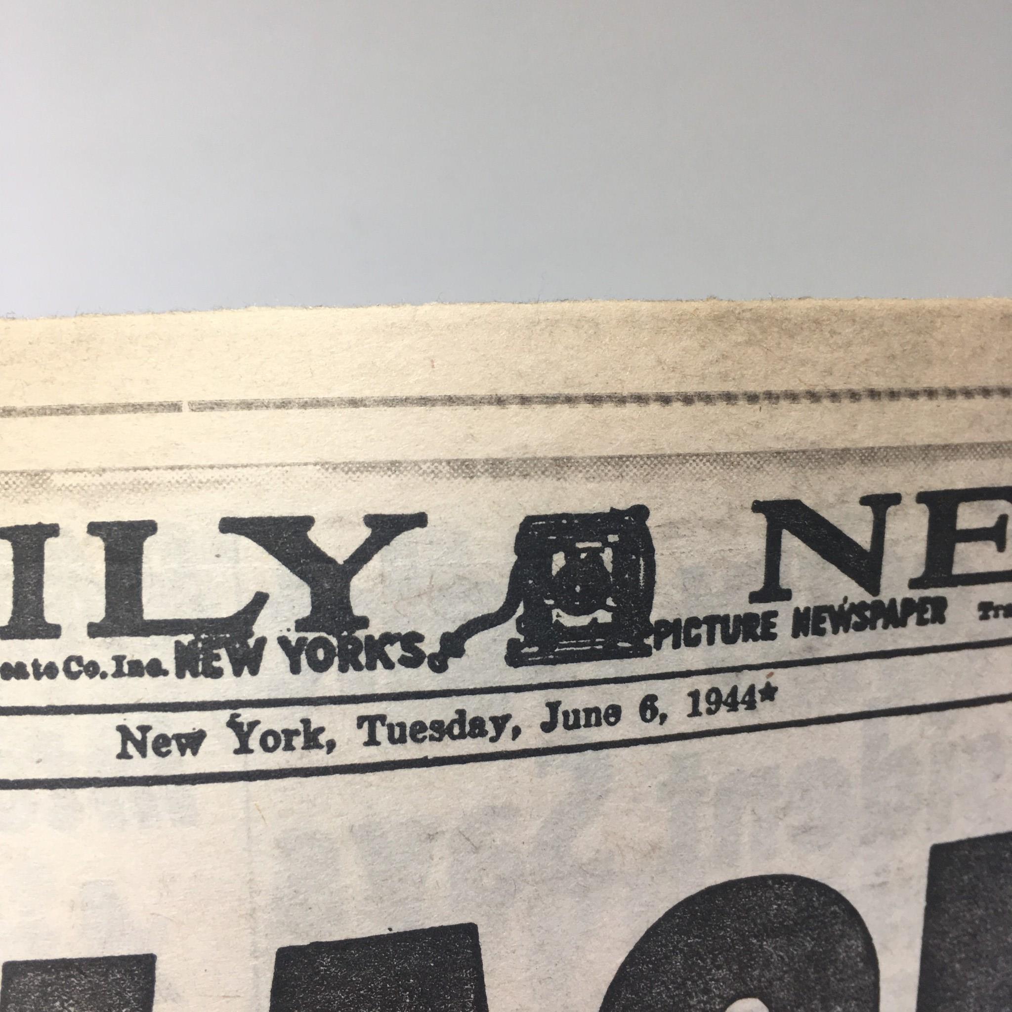 Close-up of the NY Daily News logo dated June 6, 1944, demonstrating the vintage design of the newspaper from the D-Day invasion era.
