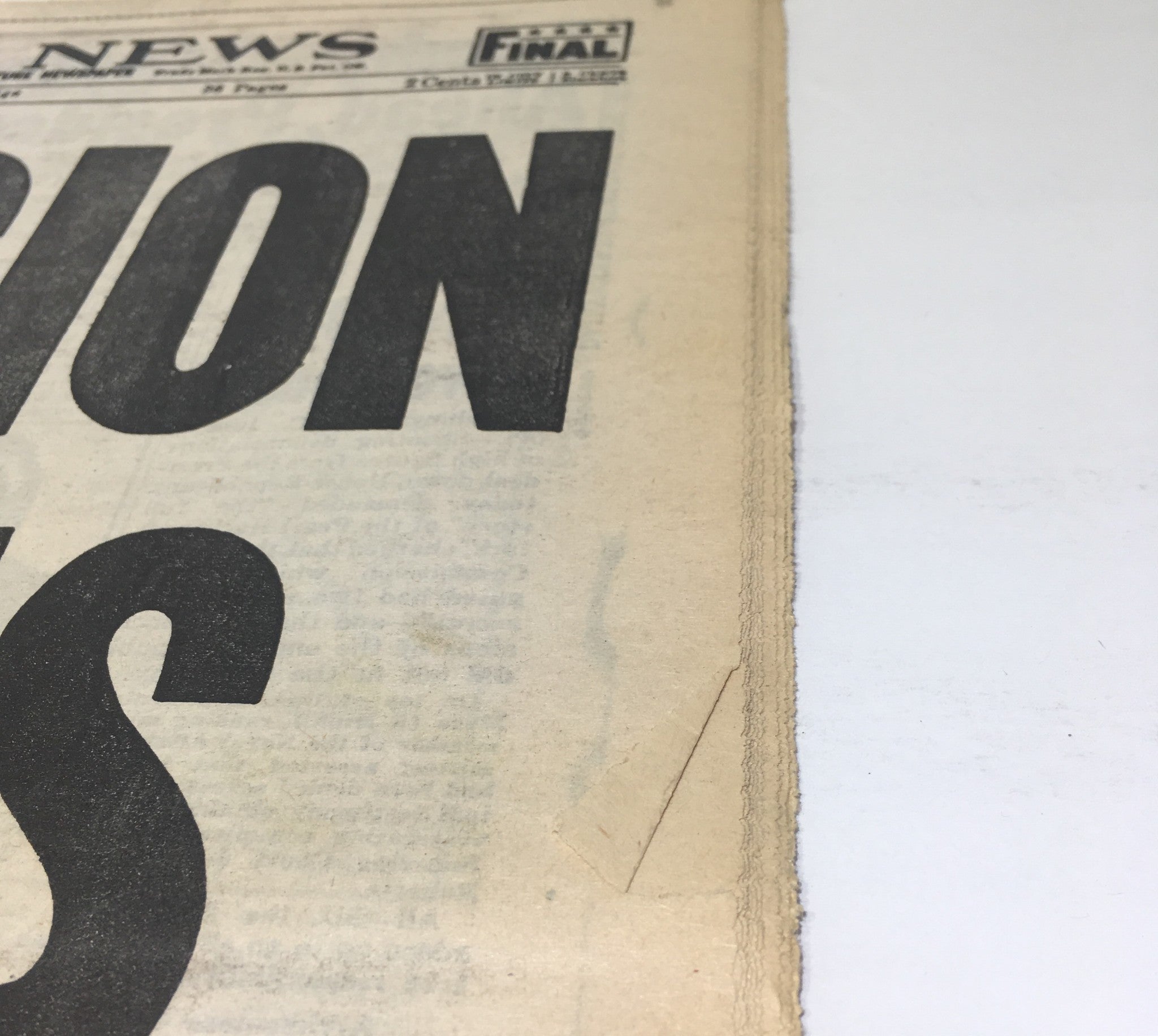 Side view of the NY Daily News June 6 1944 edition showcasing the edge and texture of the historic newspaper covering the Allied invasion of Normandy.