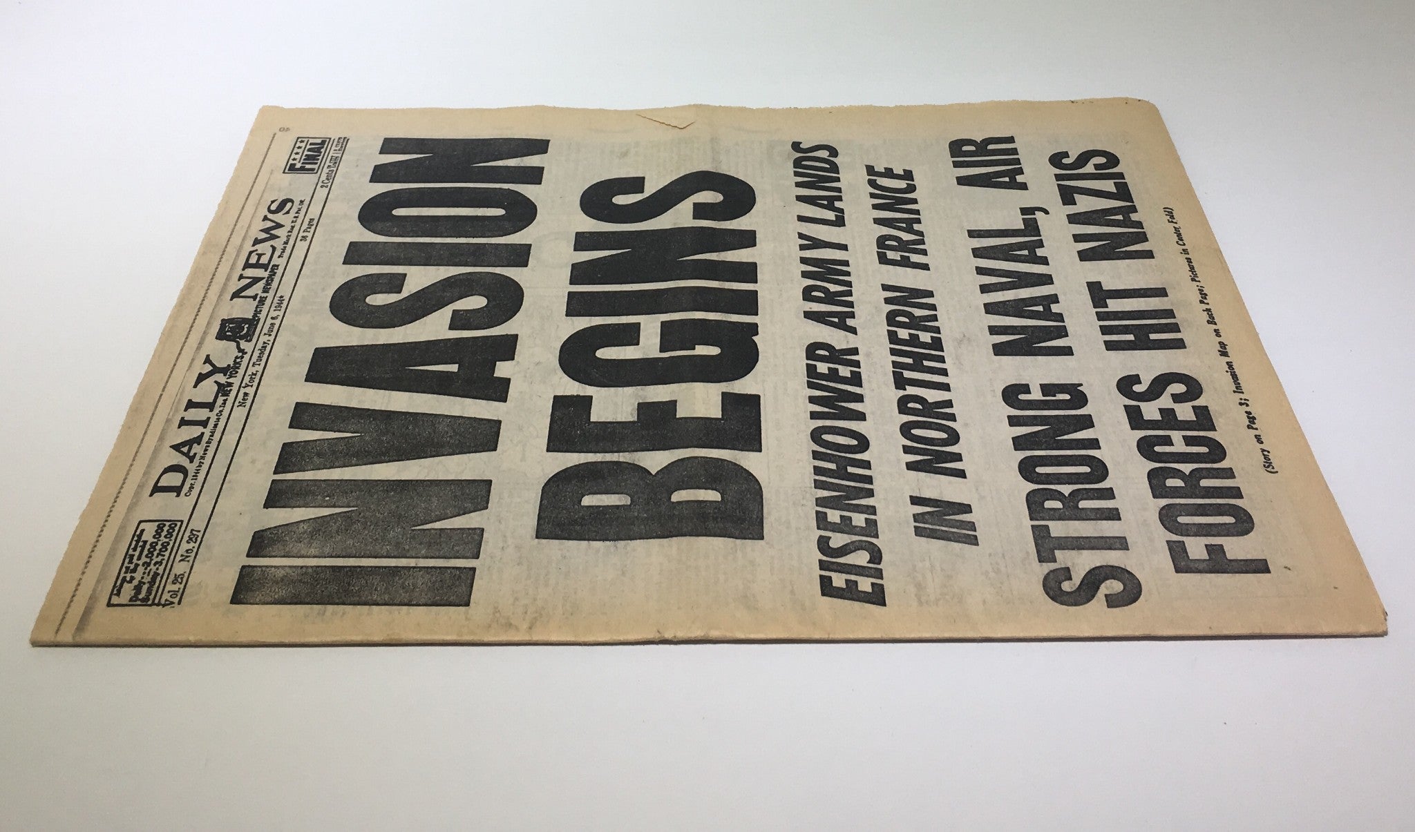 Front page of the NY Daily News: June 6 1944, announcing 'Invasion Begins' with bold headlines about Eisenhower's army landing in Northern France.