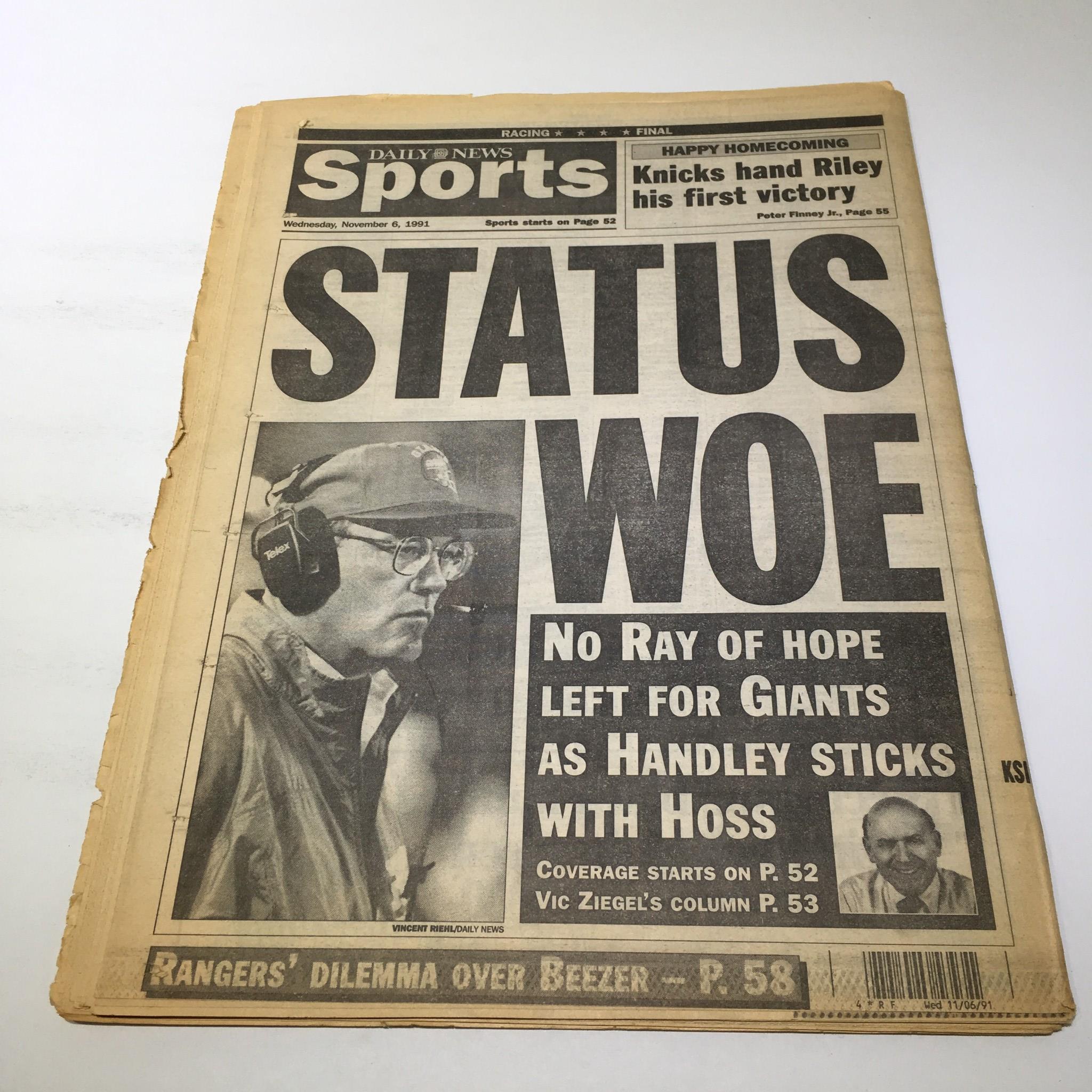 Featured cover of the November 6, 1991 NY Daily News sports section with the headline 'STATUS WOE,' related to sports events alongside a tribute to Robert Maxwell, 1923-1991.