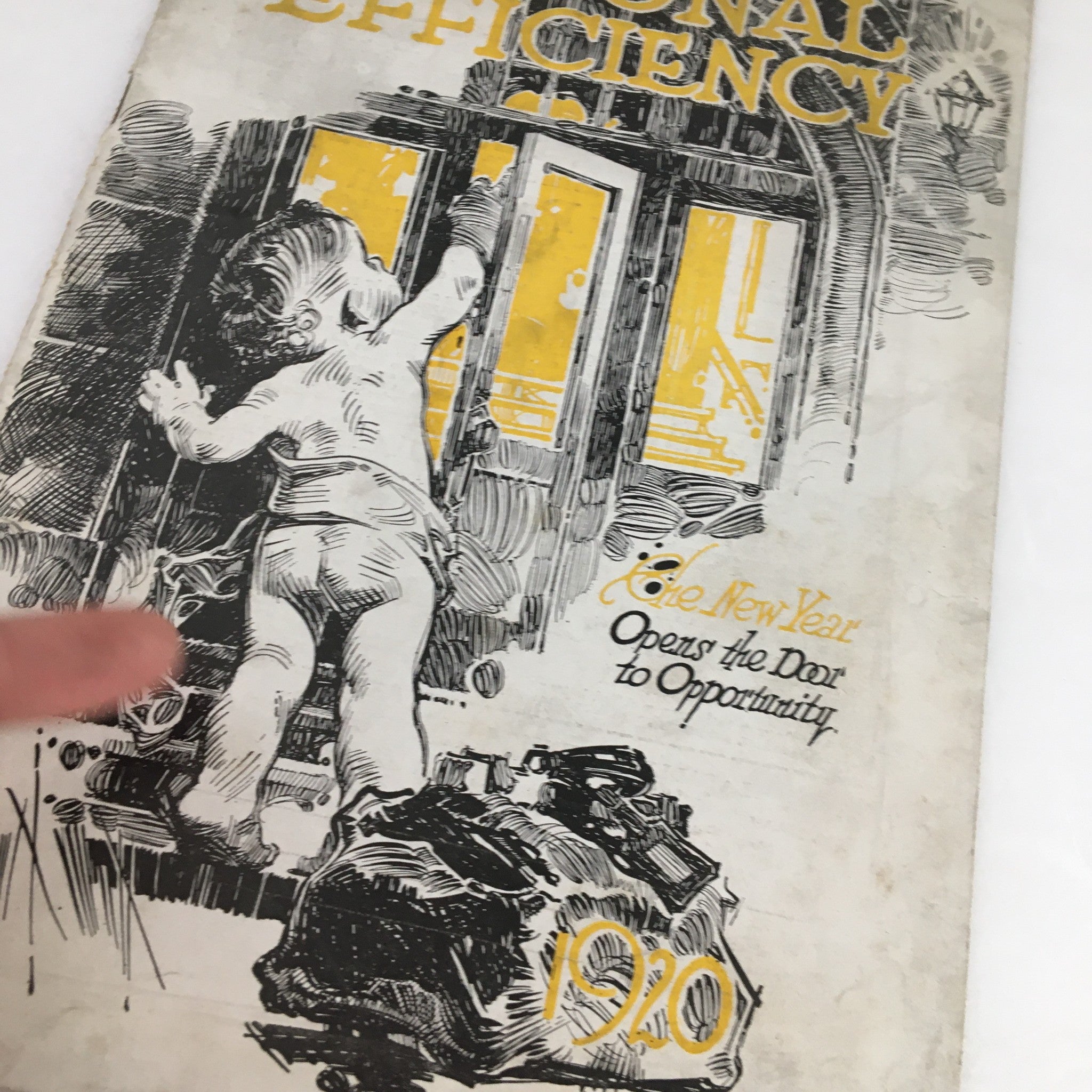 Close-up of the cover of Personal Efficiency Magazine January 1920 showing a child grasping a door handle with the caption 'The New Year Opens Door to Opportunity'.