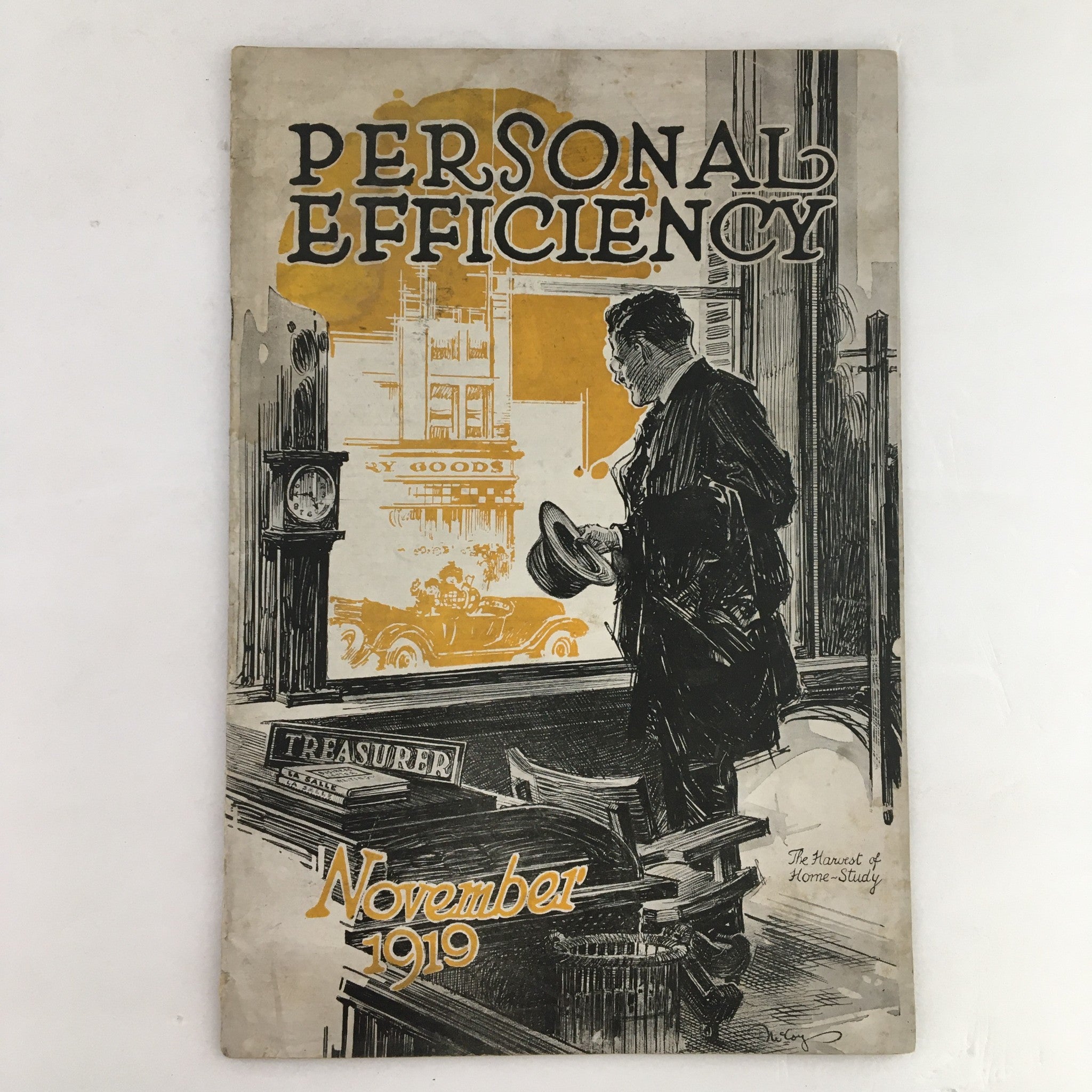 Cover of Personal Efficiency Magazine November 1919 featuring a man in a suit looking out onto the street with vintage cars, emphasizing themes of productivity and personal growth.