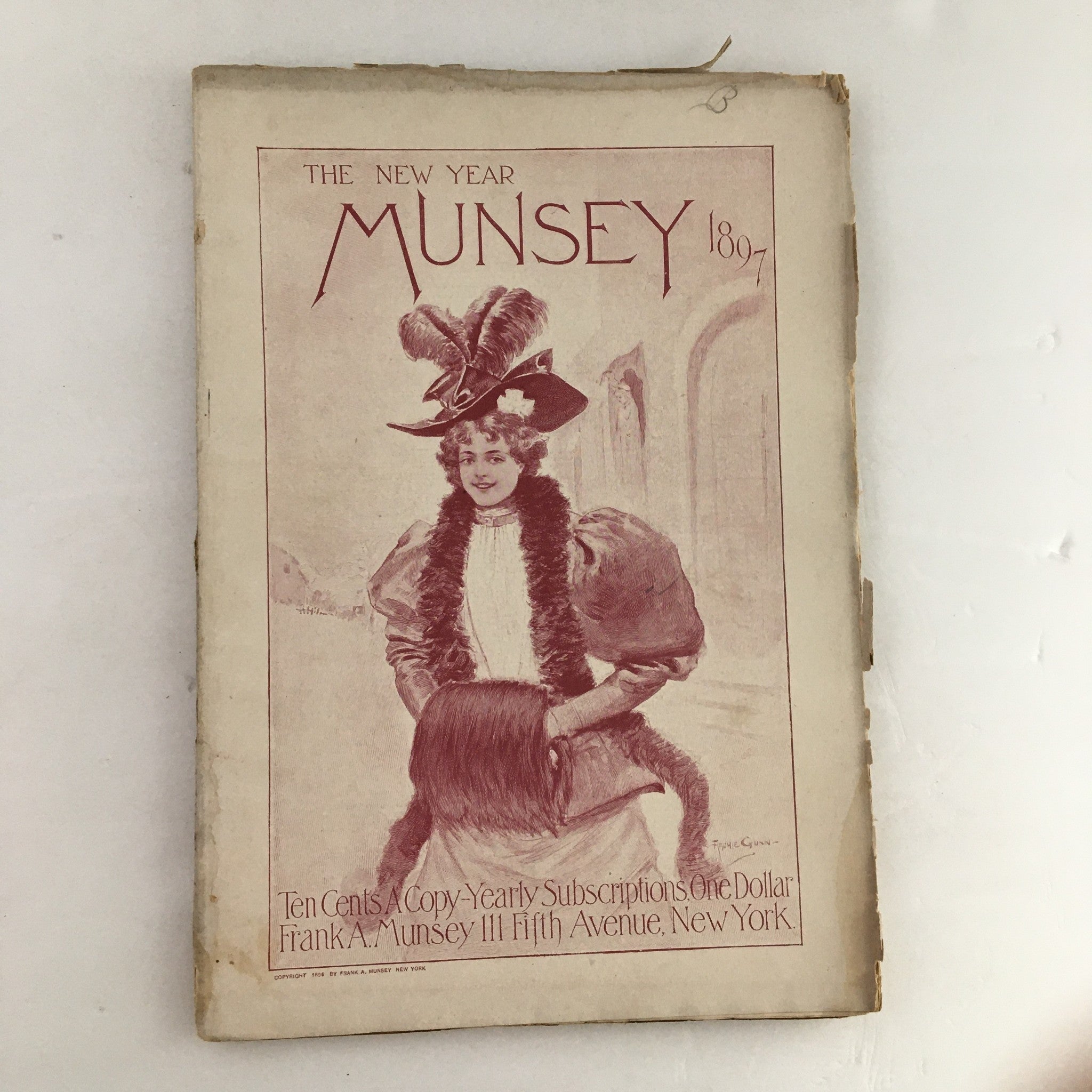 Cover page of Munsey's Magazine January 1897 featuring a woman in a hat and fur coat, with decorative text including the title 'MUNSEY'.