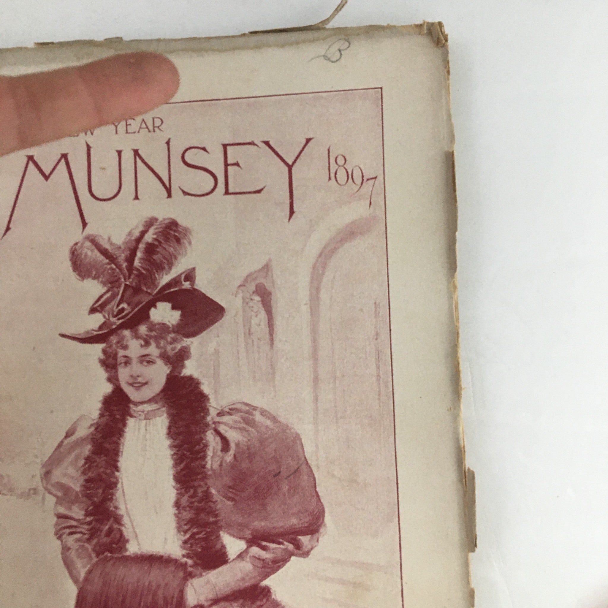 Close-up view of the cover of Munsey's Magazine January 1897 displaying a woman in elegant attire, highlighting the magazine's vintage design.