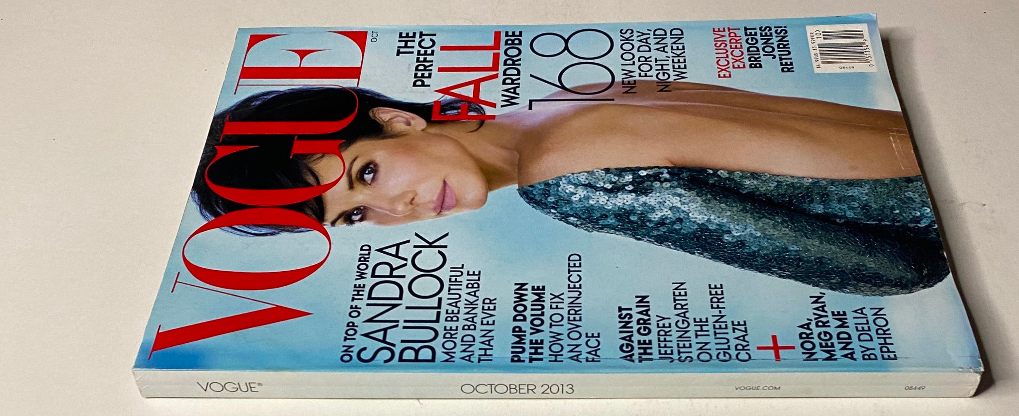 Side view of Vogue Magazine October 2013 with Sandra Bullock's cover, emphasizing the title and the seasonal fashion features within.