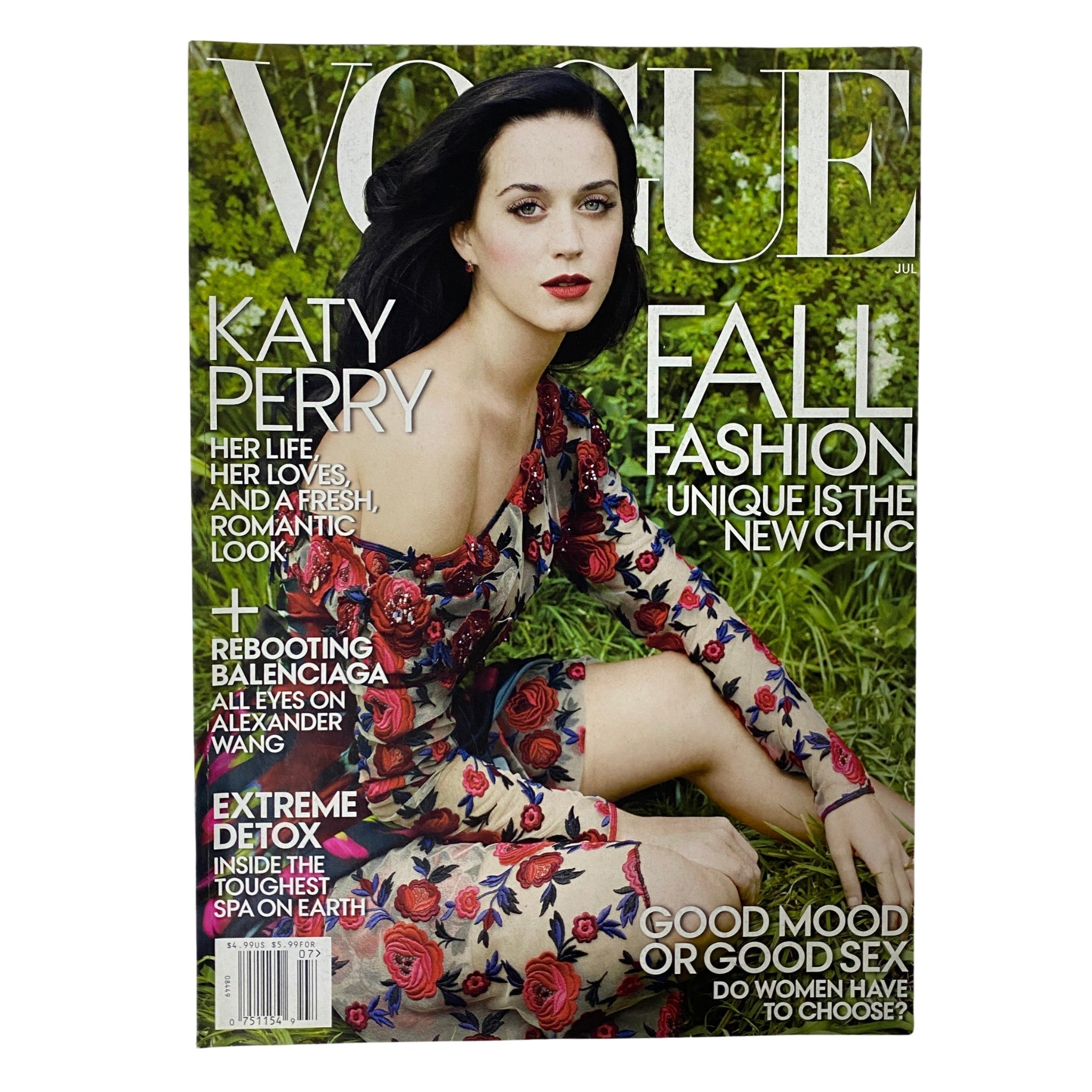 Vogue Magazine July 2013 Katy Perry Cover showcasing the pop star in a floral dress on the front page, highlighting her style and evolving persona.