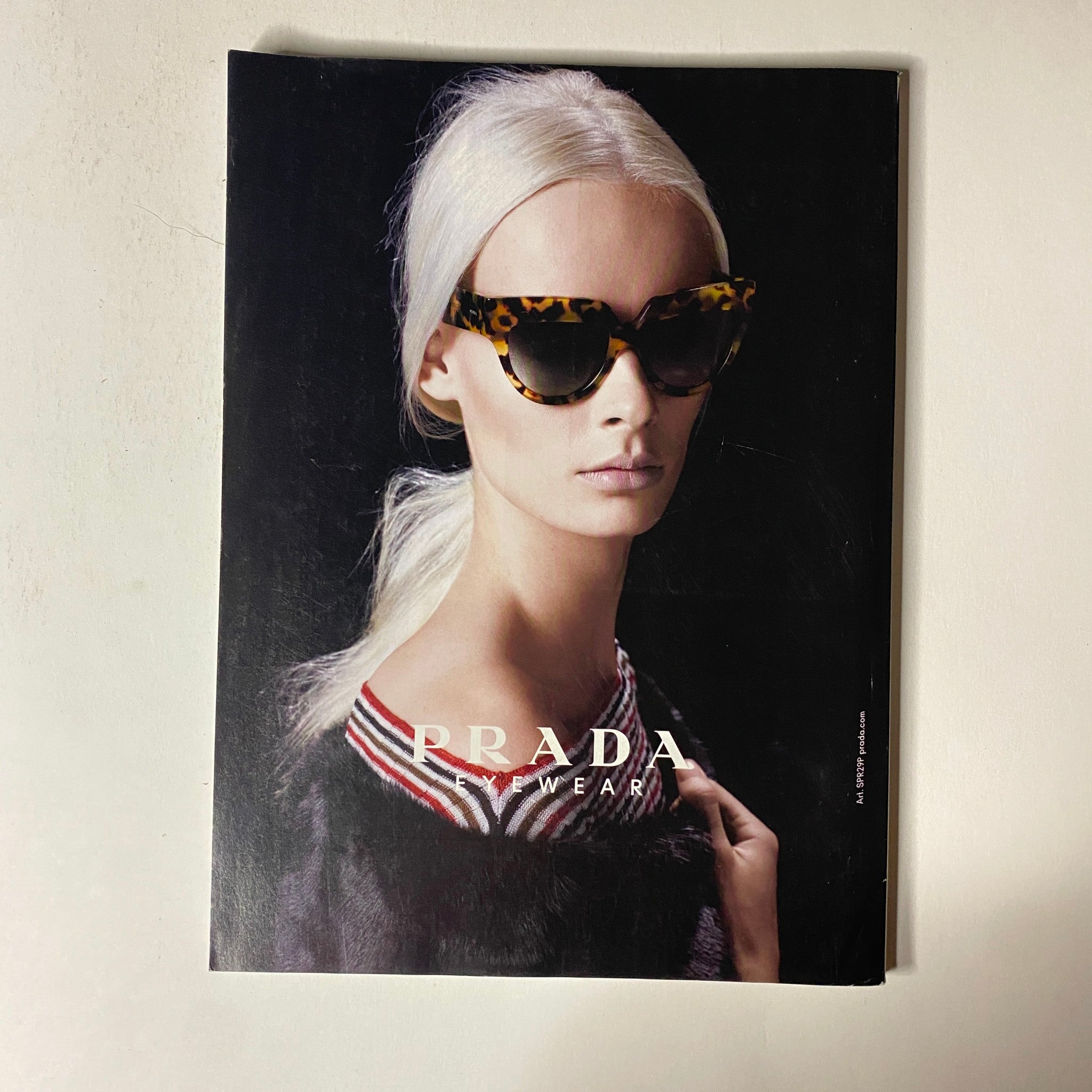 Prada eyewear advertisement from Vogue Magazine June 2013, displaying a model in stylish sunglasses emphasizing modern fashion trends and luxury accessories.