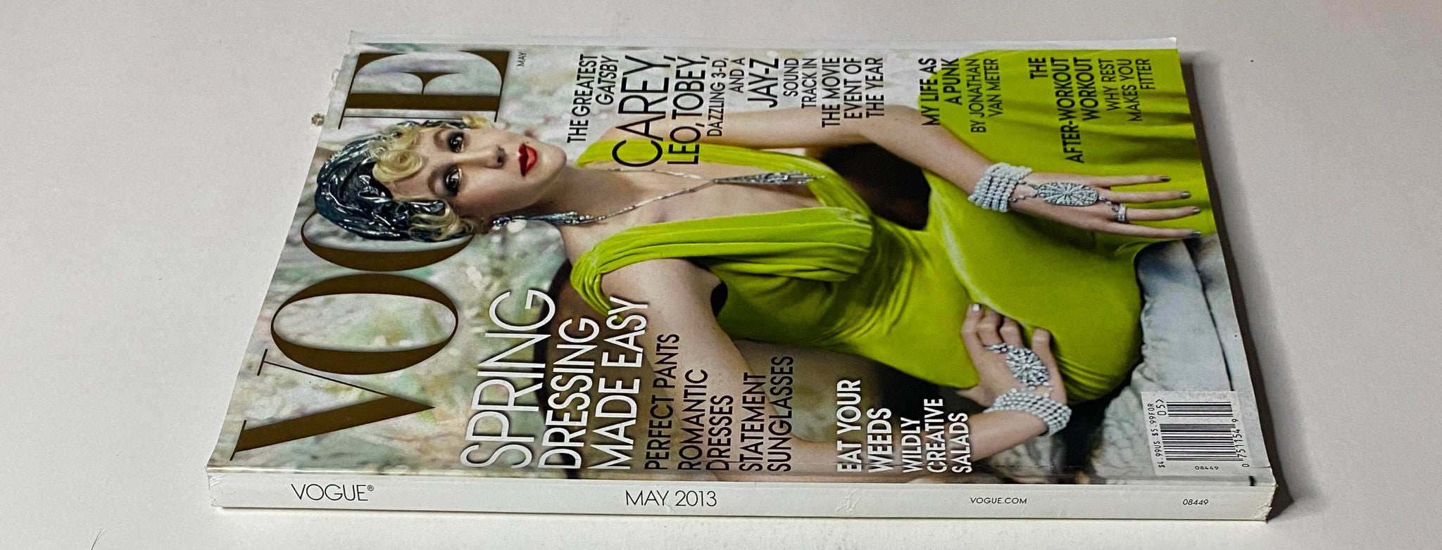 Vogue Magazine May 2013 features Carey Mulligan on the cover, showcasing a luxurious green dress styled in Dior Haute Couture.