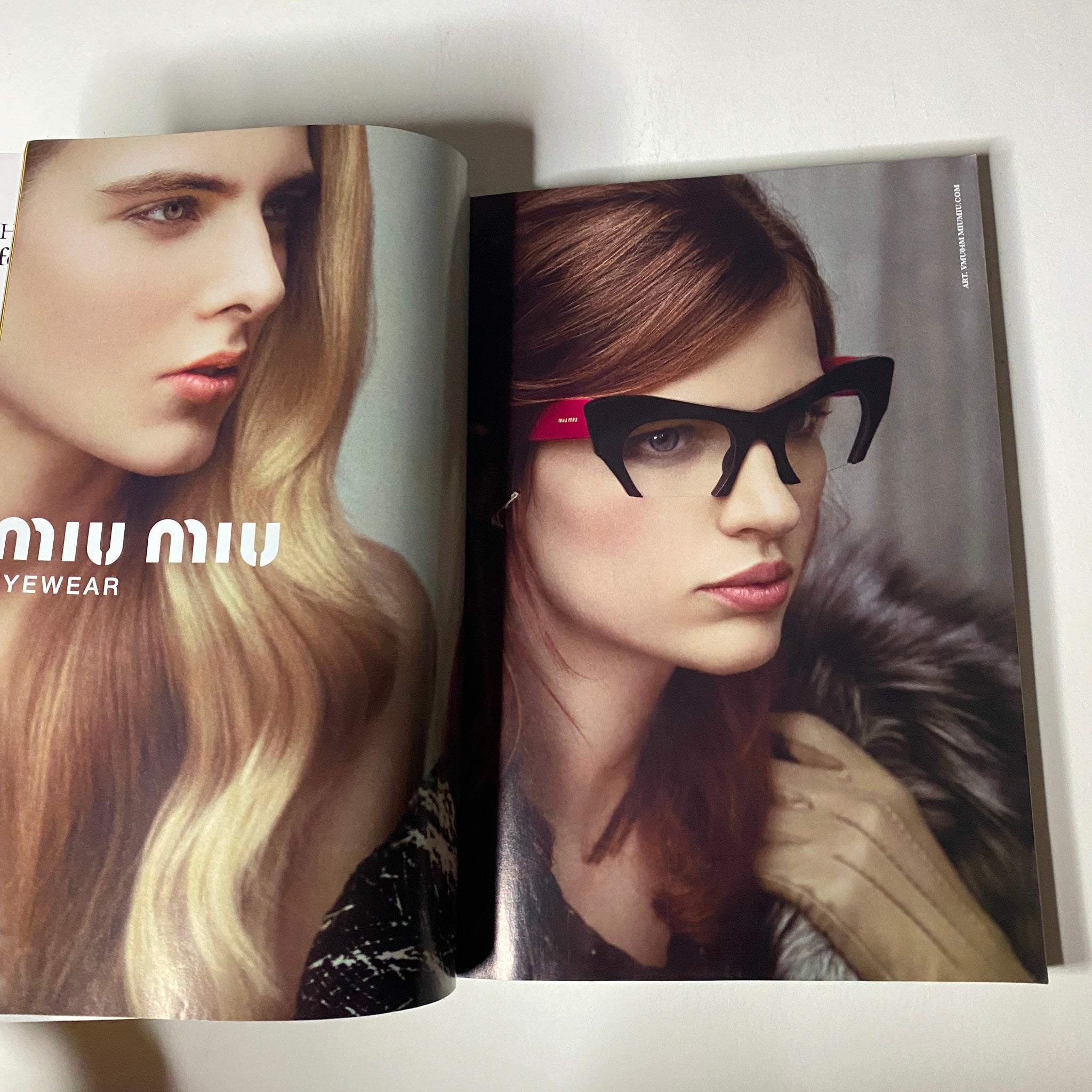 Vogue Magazine May 2013 double-page spread featuring Miu Miu eyewear advertisement, emphasizing bold fashion and styling.