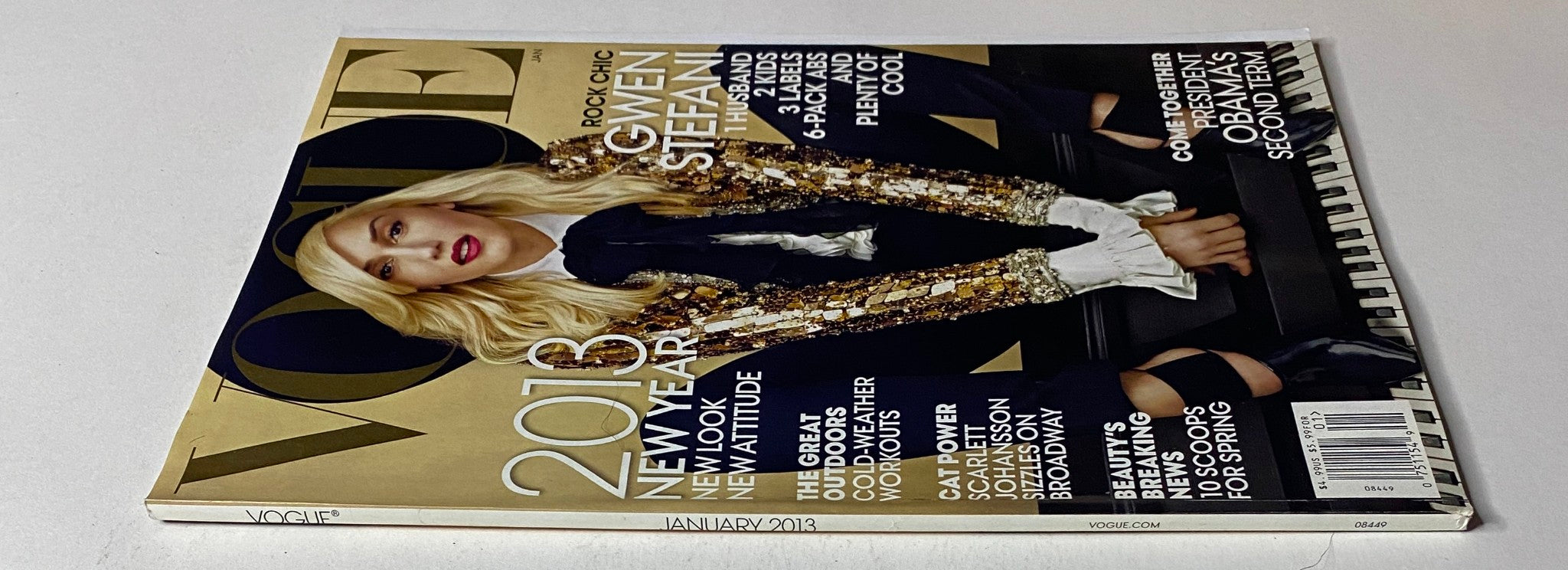 Back view of Vogue Magazine January 2013 with Gwen Stefani on the cover, showcasing a glamorous design; details include features on celebrity life and beauty trends for the New Year.