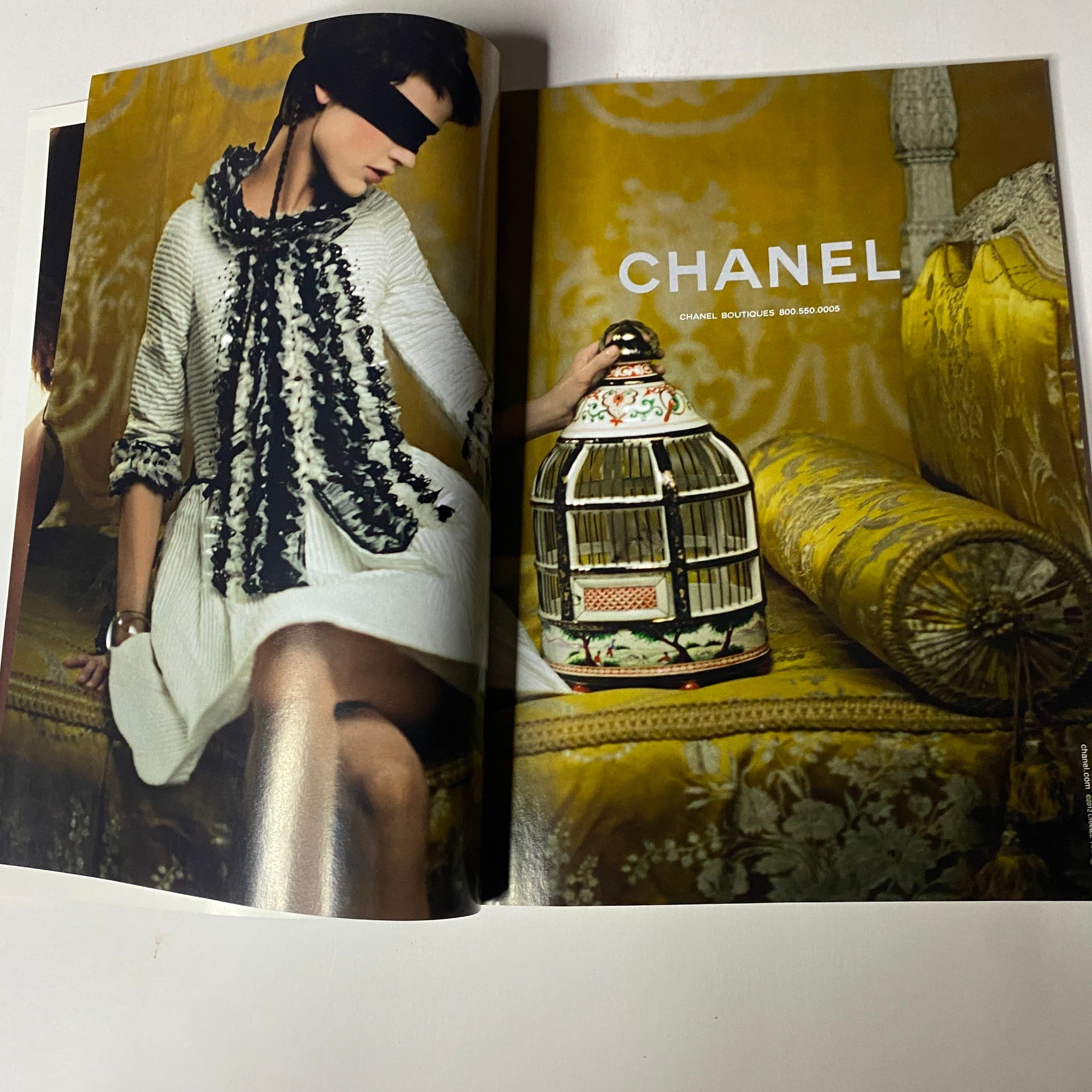 Inside spread of Vogue Magazine January 2013 featuring a chic model in a sophisticated Chanel outfit, symbolizing luxury fashion and elegance.