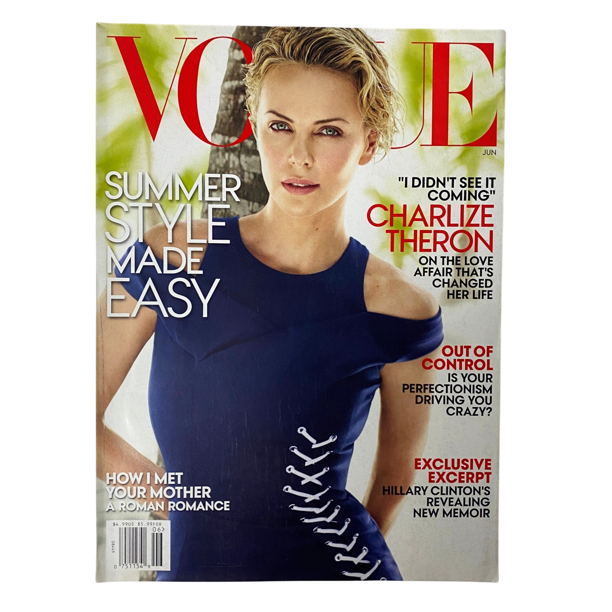 Vogue Magazine June 2014 cover featuring Charlize Theron in a stylish blue dress, highlighting summer fashion trends and promoting the issue's editorial content.