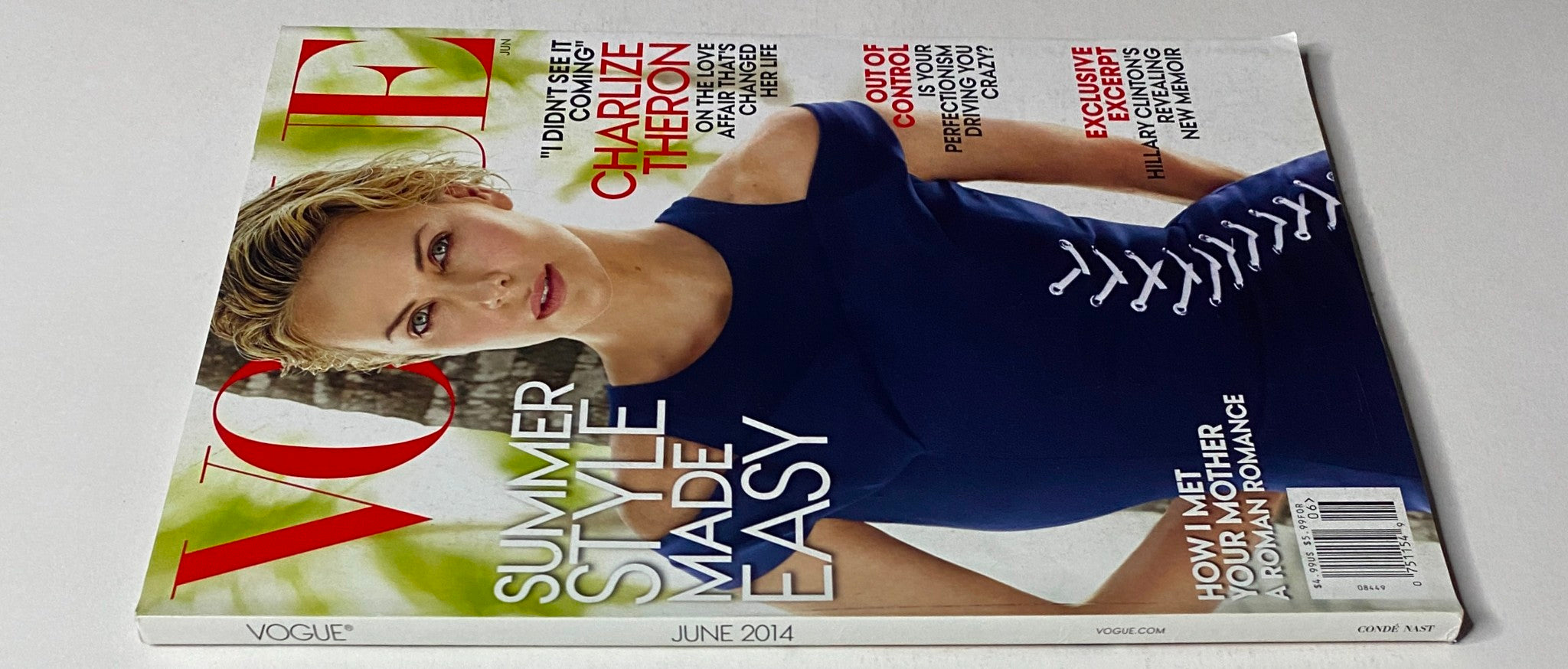 Vogue Magazine June 2014 cover featuring Charlize Theron, showcasing summer style trends in vibrant colors.