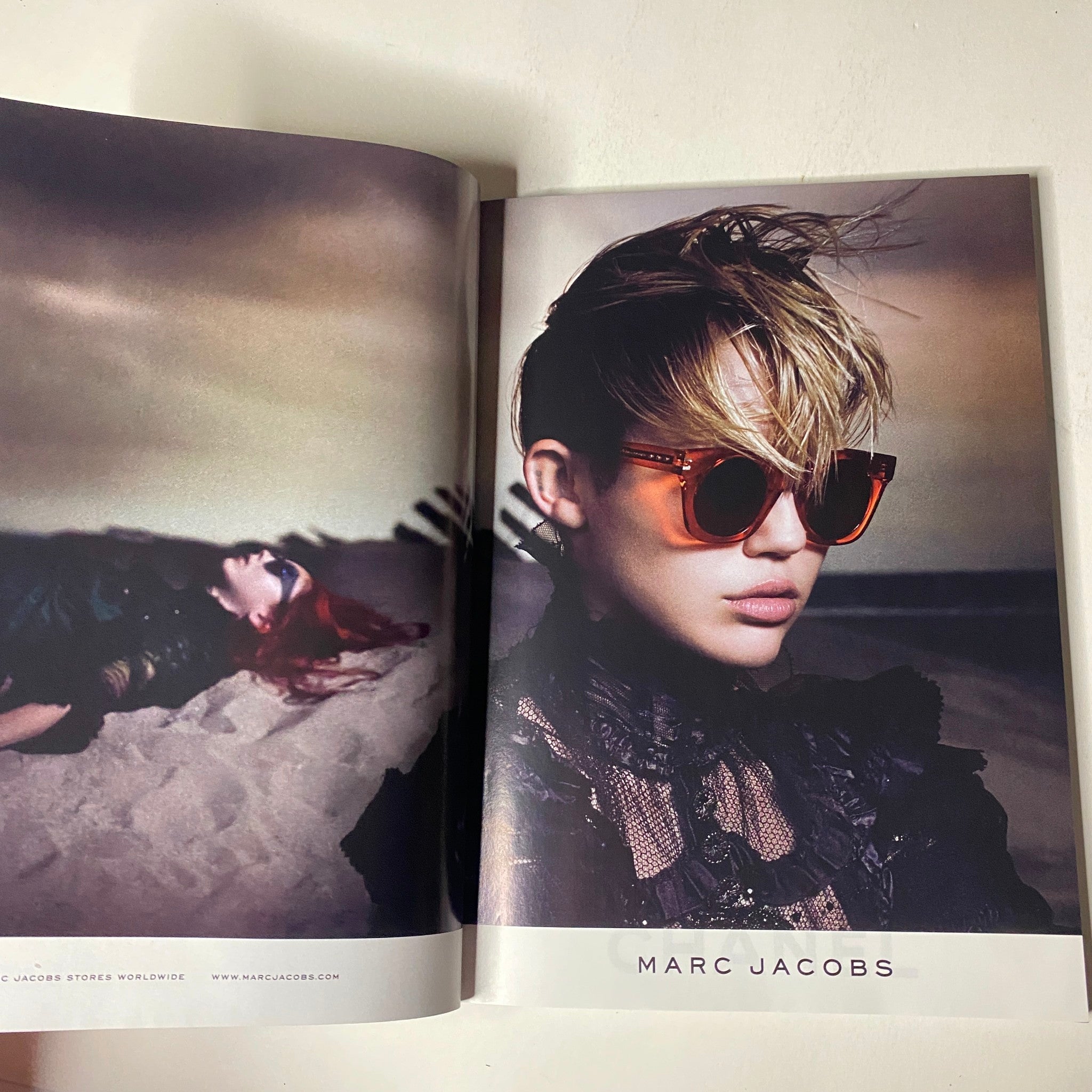 Fashion editorial from Vogue Magazine June 2014 displaying a model in Marc Jacobs sunglasses, emphasizing modern chic styles.