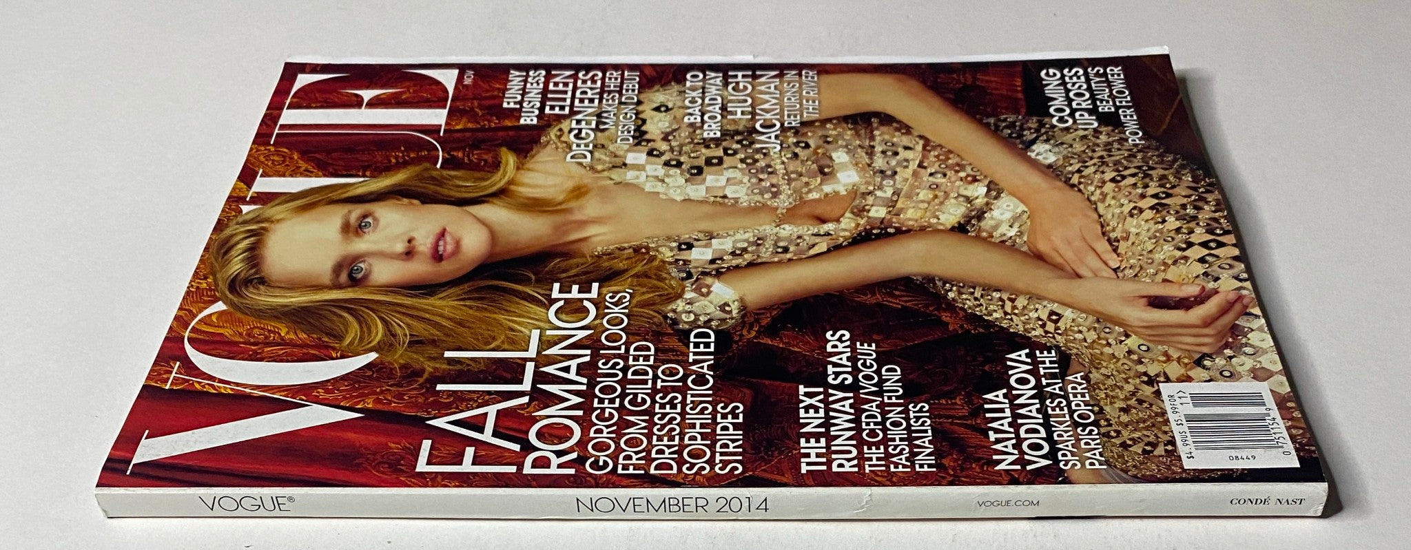 Side view of Vogue Magazine November 2014 with Natalia Vodianova on the cover, showcasing discussions on 'Fall Romance' and fashion insights.