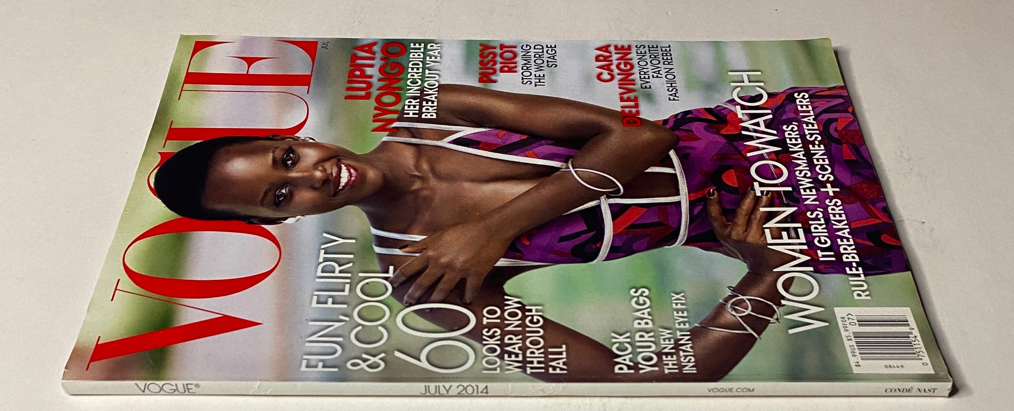 Another view of the July 2014 Vogue Magazine cover with Lupita Nyong'o, showcasing her stunning style and the magazine's focus on fashion and cultural highlights, emphasizing her influence.