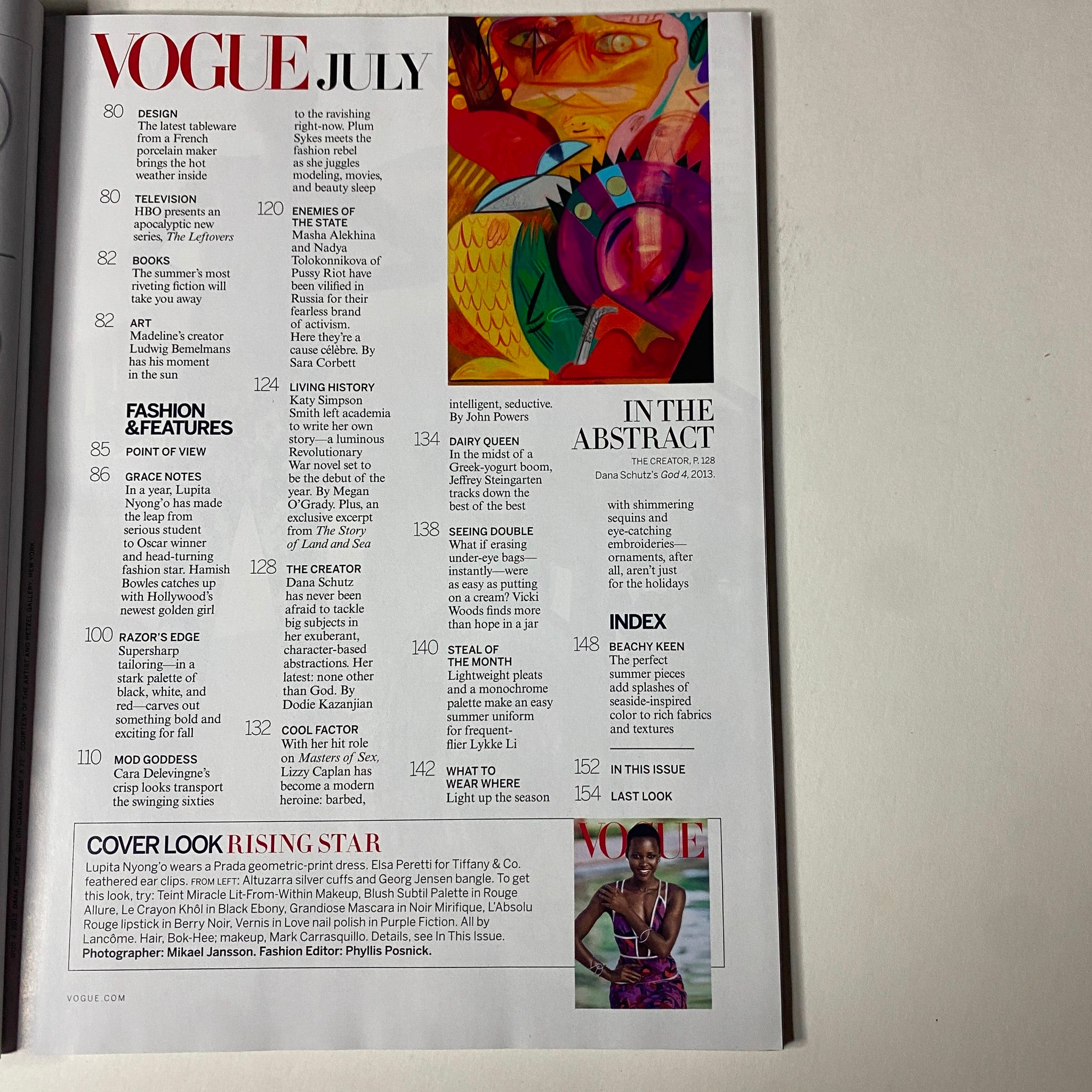 Inside page of Vogue Magazine July 2014 featuring various articles including 'Television', 'Fashion & Features', and cultural highlights, showcasing Lupita Nyong'o as the cover star.
