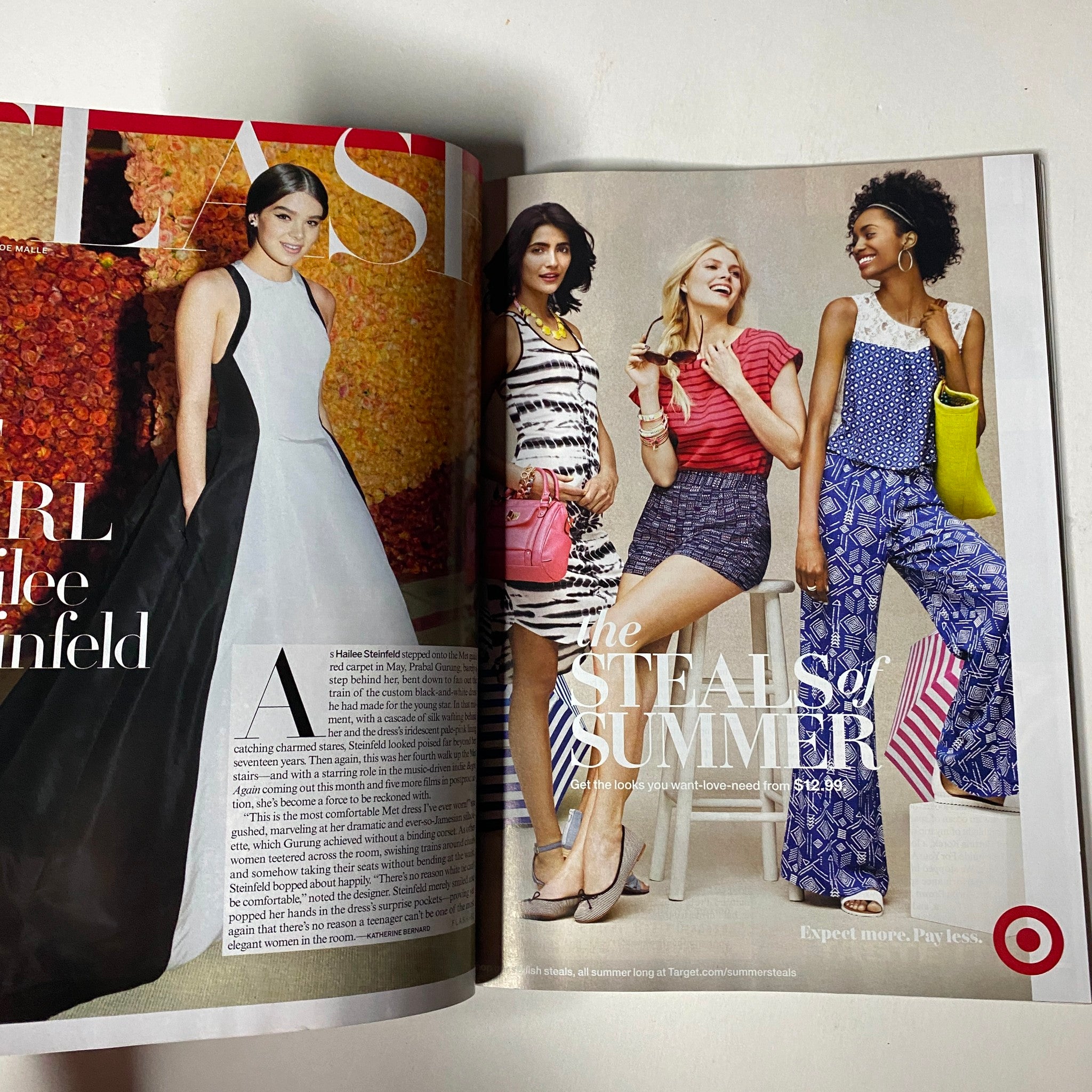 Full-page spread from Vogue Magazine July 2014 showcasing summer fashion looks with models wearing trendy outfits and accessories, labeled 'The Steals of Summer'.
