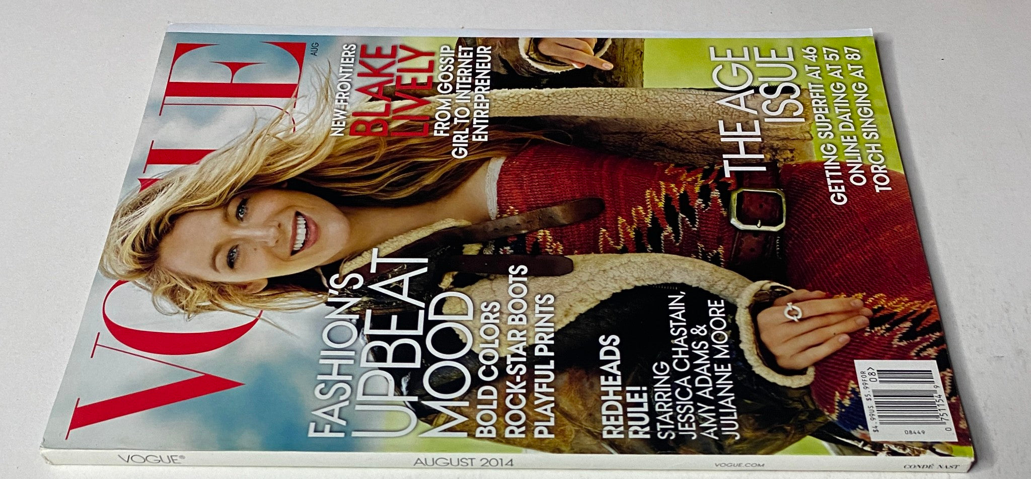 Vogue Magazine August 2014 featuring Blake Lively on the cover, emphasizing fashion trends and lifestyle insights in a chic presentation.