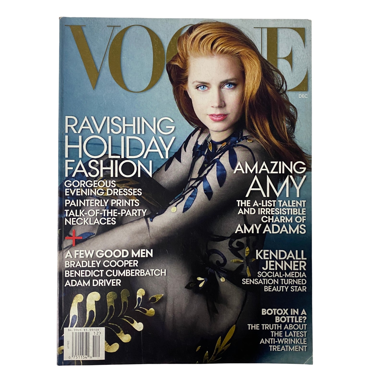Vogue Magazine cover from December 2014 featuring actress Amy Adams, highlighting holiday fashion and cultural moments with an emphasis on her charm and captivating presence.