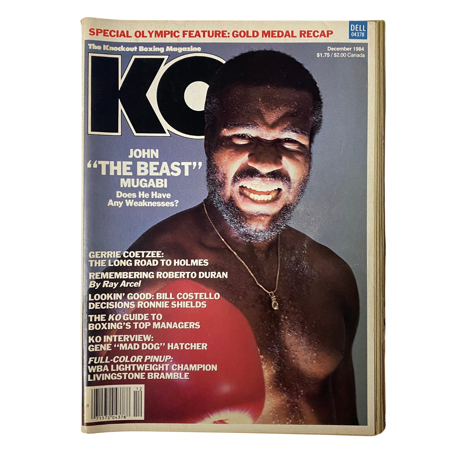 KO Boxing Magazine December 1984 featuring John 'The Beast' Mugabi on the cover, showcasing the feared knockout artist in a strong pose, highlighting his rise toward a world title.