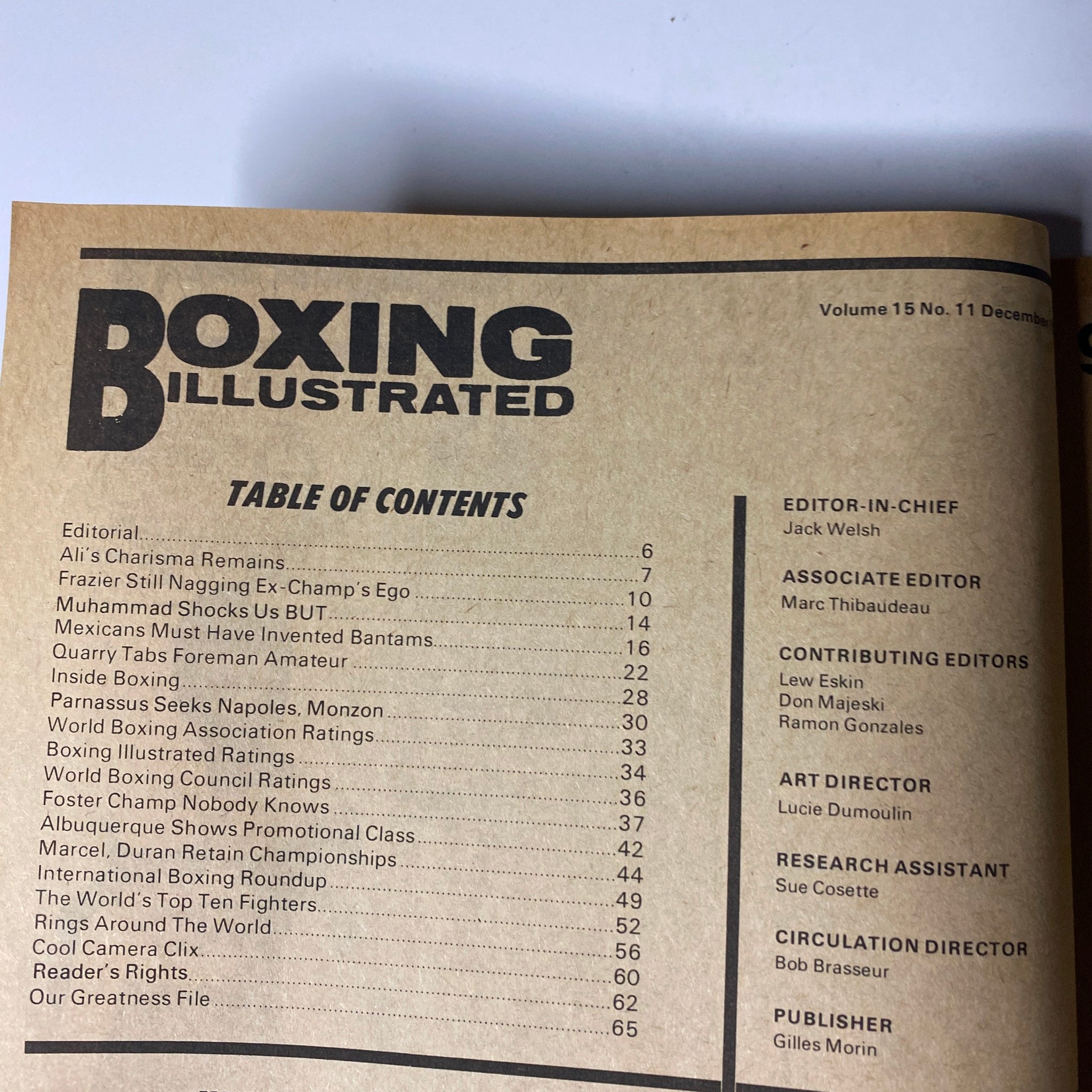 Table of contents from Boxing Illustrated Magazine December 1973, listing articles including 'Ali's Charisma Remains' and 'Muhammad Shocks Us BUT...', providing insight into the key features of this boxing issue.