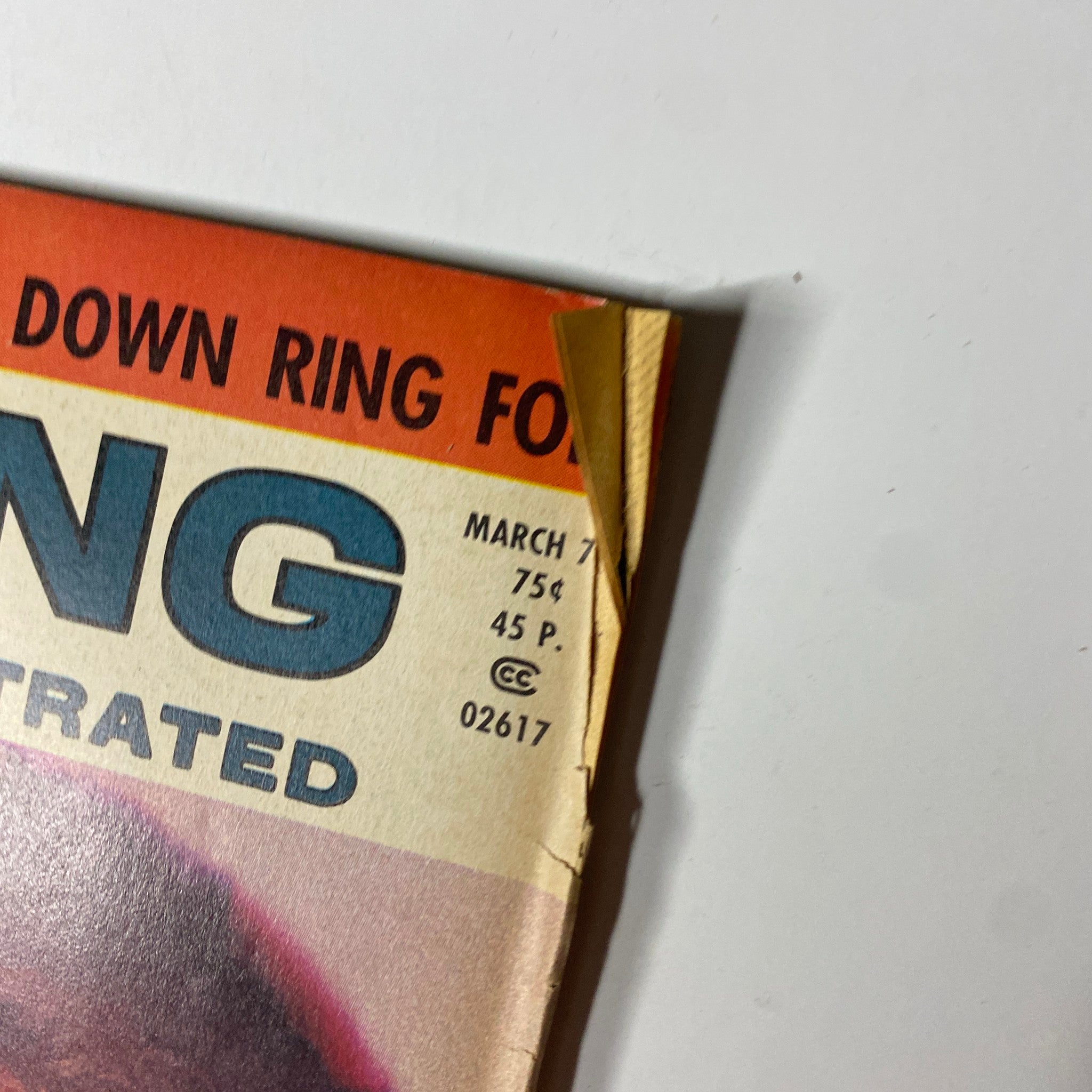 Close-up of the top corner of Boxing Illustrated Magazine March 1974, highlighting the date and publication details.