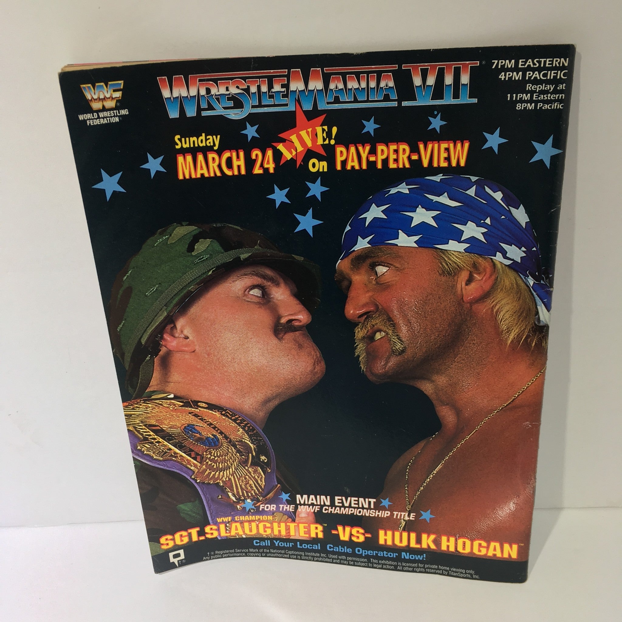 Promotional page for WrestleMania VII from WWF Magazine, showcasing a match between Sgt. Slaughter and Hulk Hogan, April 1991.