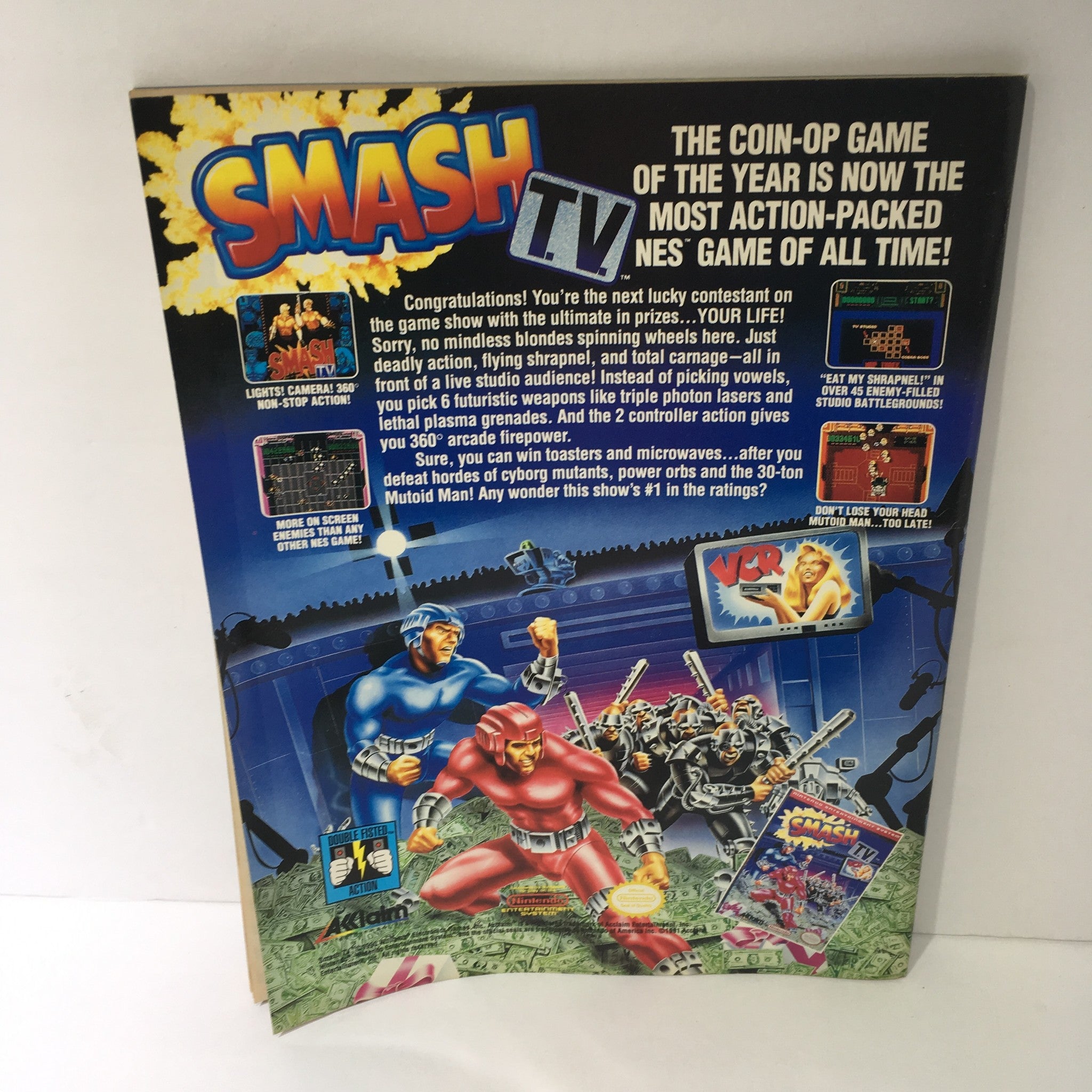 Back cover of WWF Magazine: Randy and Elizabeth October 1991 featuring a promotional for the video game Smash TV with colorful graphics and a description of gameplay.