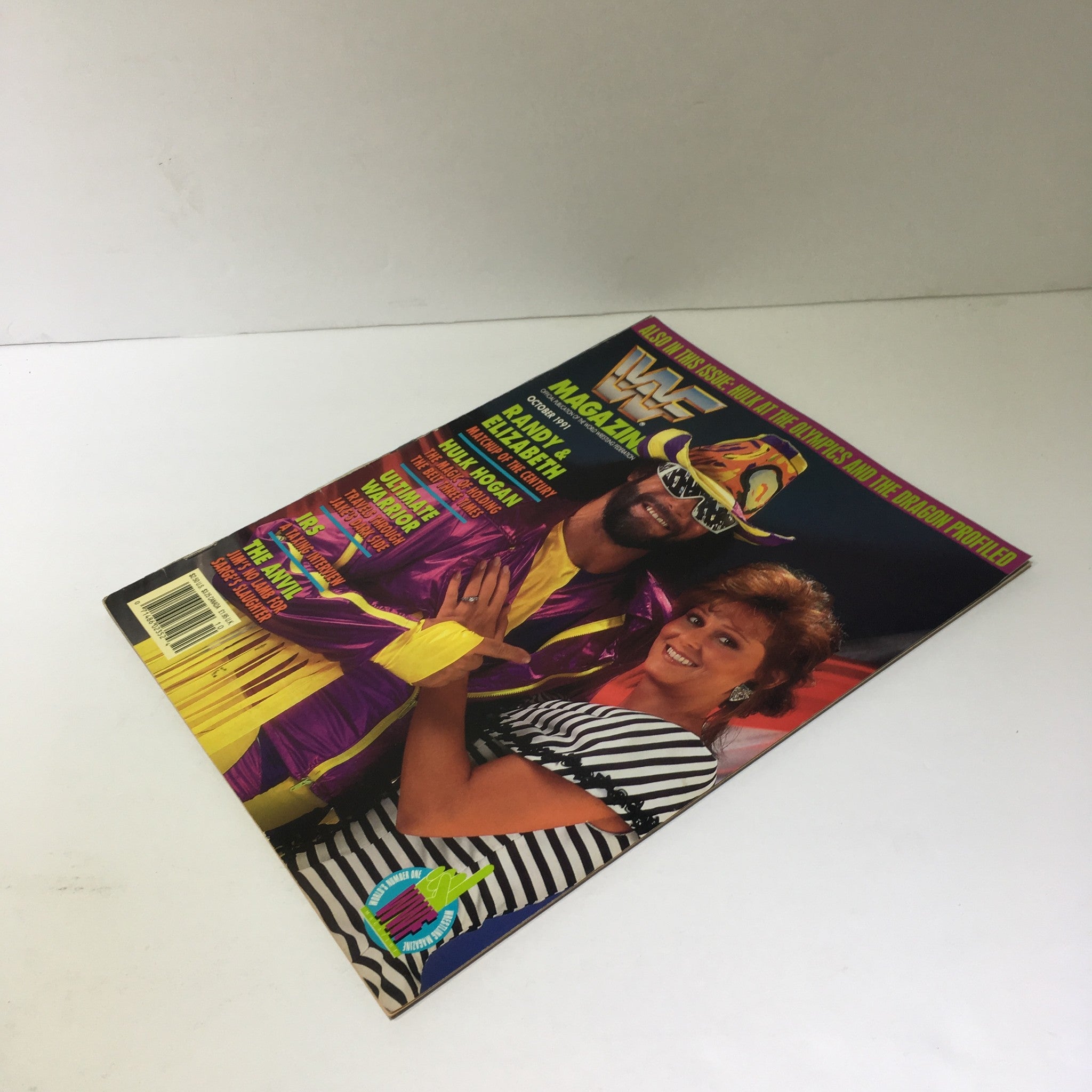 Front cover of WWF Magazine: Randy and Elizabeth October 1991 showcasing Randy Savage in vibrant wrestling attire with Elizabeth, highlighting iconic wrestling personalities.