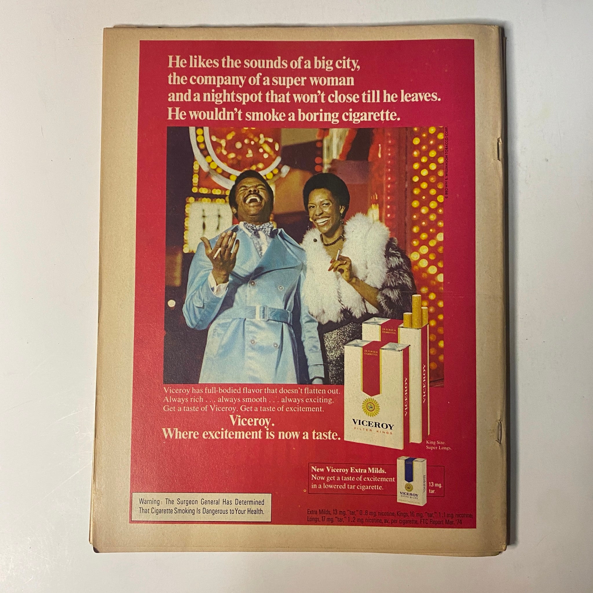 Back cover advertisement from the Black Sports Magazine – September 1974 issue featuring Muhammad Ali vs. George Foreman. The ad promotes Viceroy cigarettes with imagery of a glamorous couple enjoying a nightlife scene.