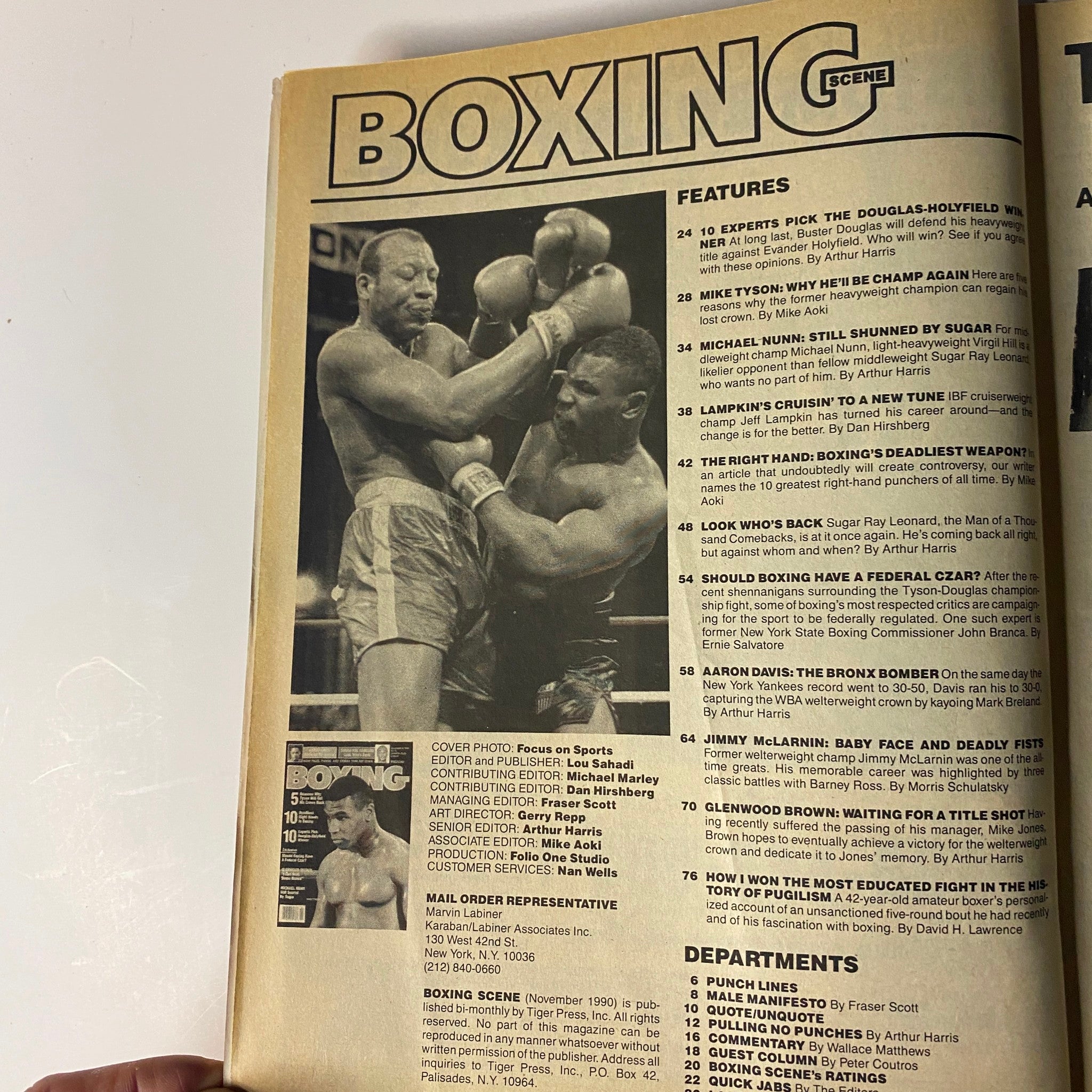 Boxing Scene Magazine November 1990 featuring Mike Tyson on the cover, showcasing highlights from the issue including features on notable boxing matches and fighters of the time.