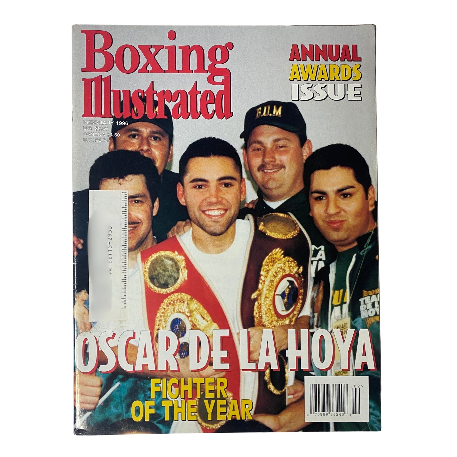 Boxing Illustrated Magazine February 1996 featuring Oscar De La Hoya on the cover, celebrating him as Fighter of the Year with the annual awards issue. The cover showcases De La Hoya surrounded by fans and fellow boxers, highlighting his rise in the boxing world during the mid-1990s.