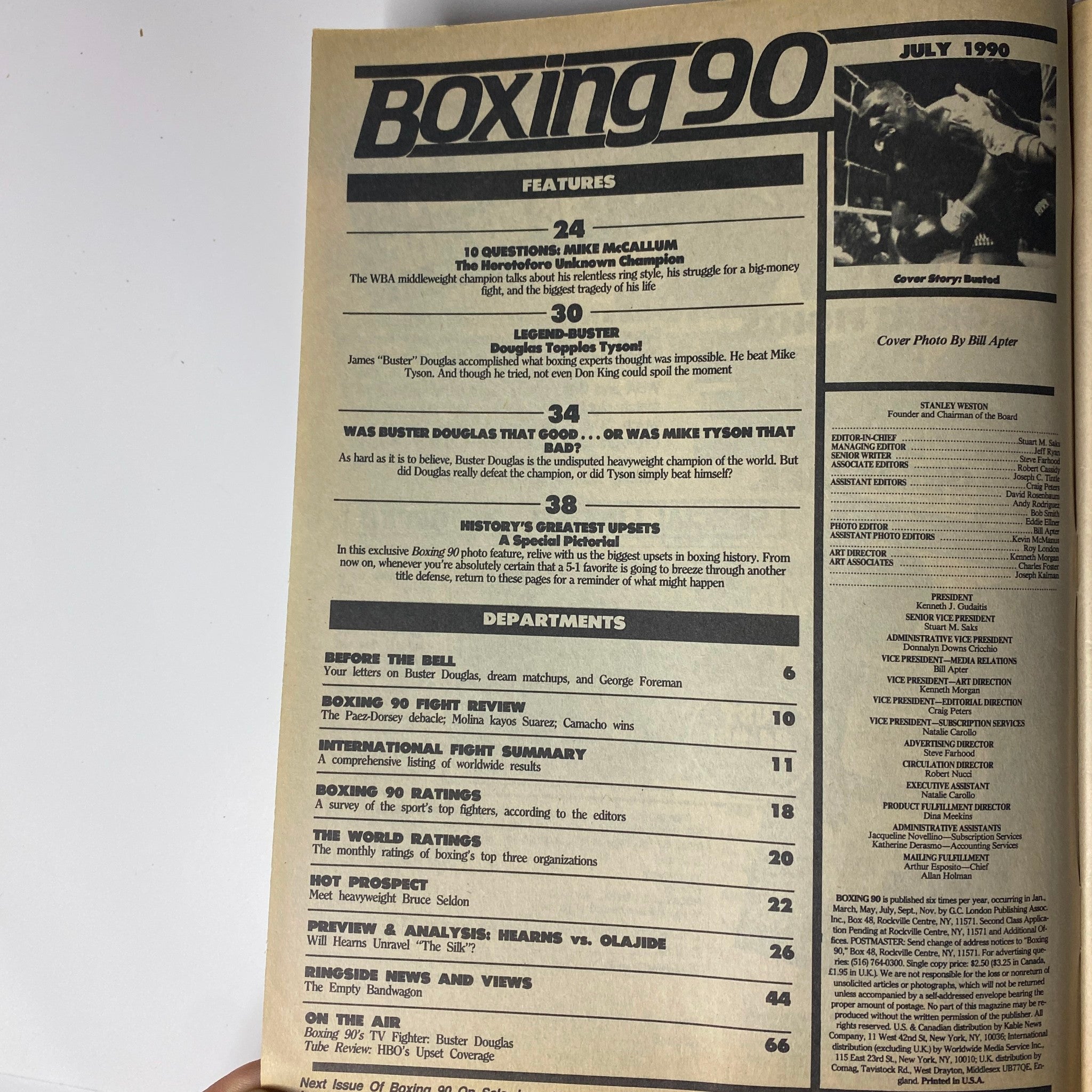 Interior page from Boxing 90 Magazine, July 1990, featuring article titles including '10 Questions: Mike McCallum', 'Douglas Topples Tyson!', and 'History's Greatest Upsets', highlighting Buster Douglas's historic win over Mike Tyson.