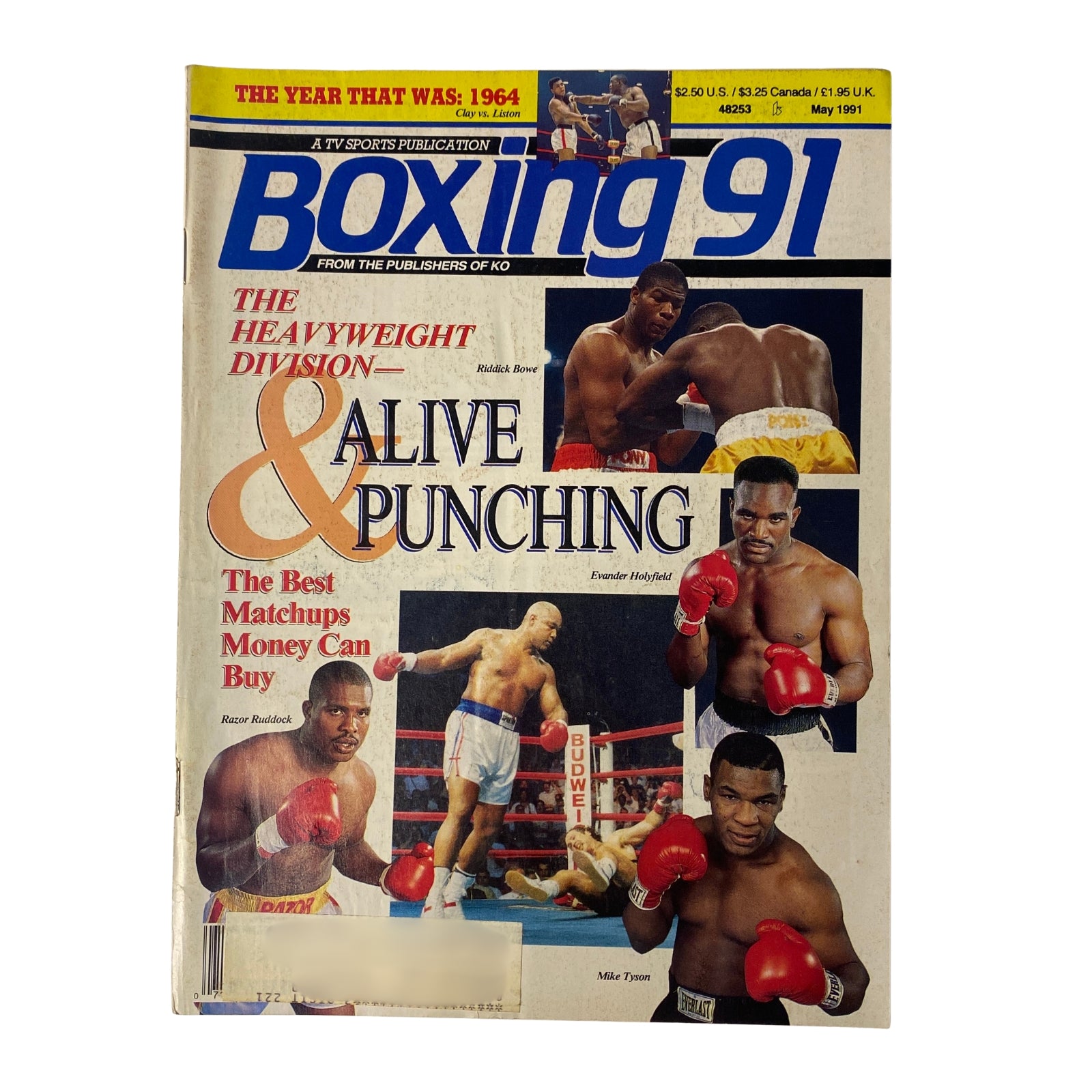 Cover of Boxing 91 Magazine May 1991 featuring prominent boxers Riddick Bowe and Evander Holyfield. The magazine highlights the heavyweight division's best matchups and includes references to the year's boxing history.