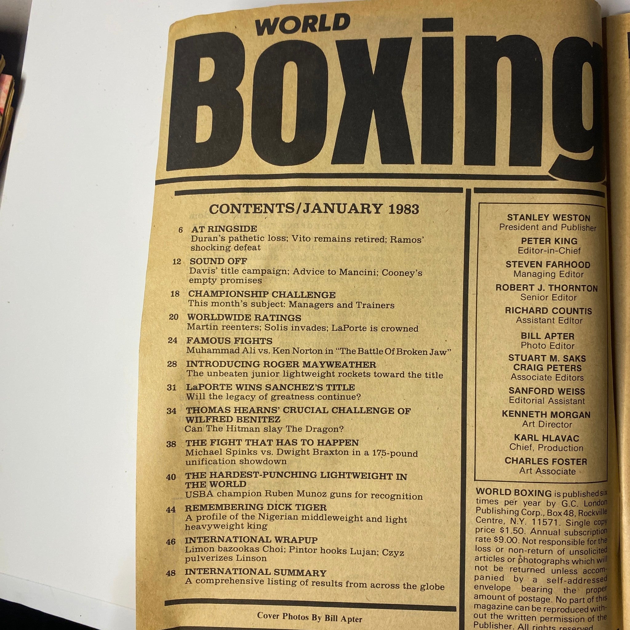 World Boxing Magazine January 1983 image featuring the contents page with articles on Thomas Hearns, Wilfred Benitez, and significant boxing events. Highlights include 'At Ringside', 'Famous Fights: Muhammad Ali vs. Ken Norton', and profiles of rising stars. This collectible magazine is in good condition, reflecting its historical significance in boxing.