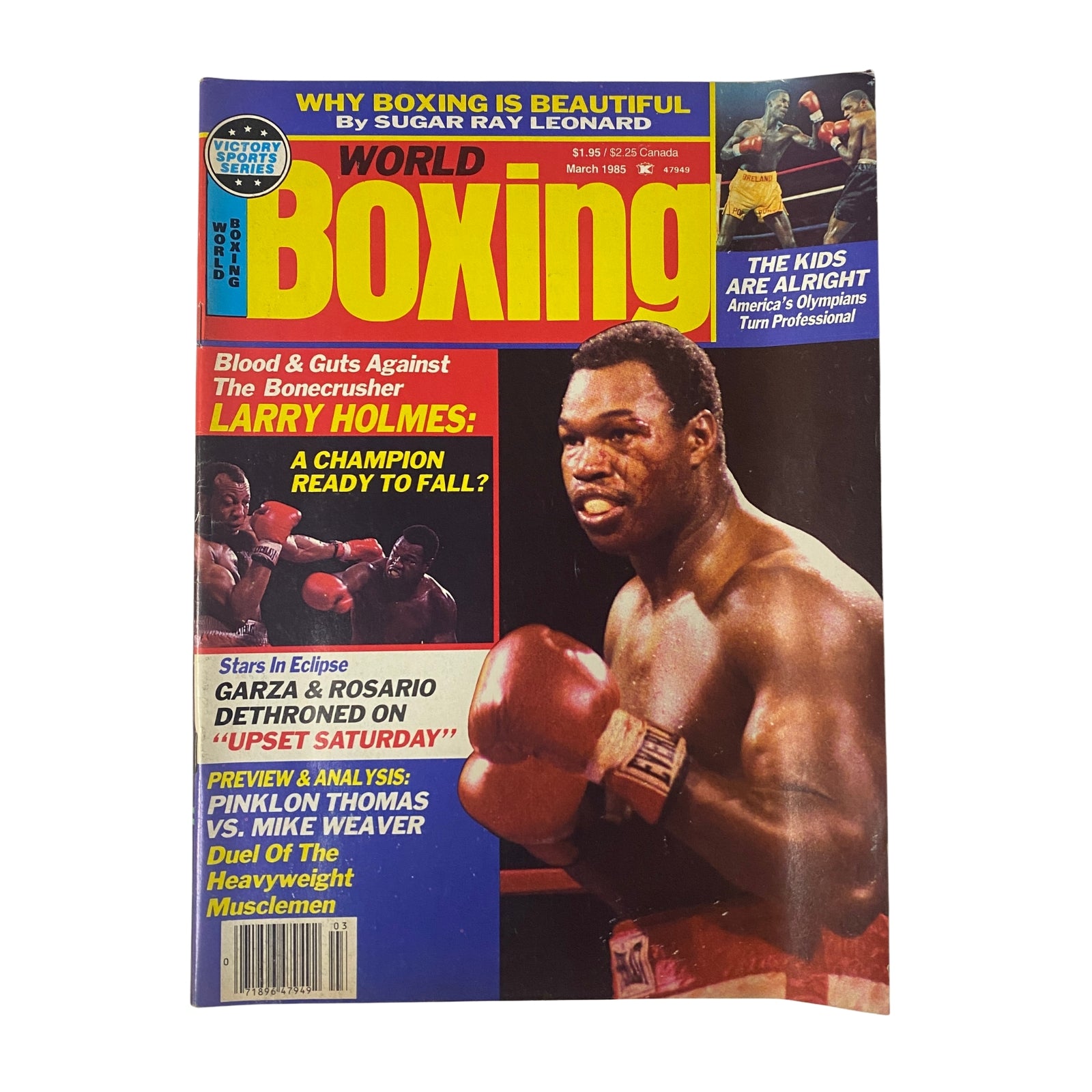 World Boxing Magazine March 1985 featuring heavyweight legends Larry Holmes and Pinklon Thomas on the cover, highlighting boxing's key events and insights.