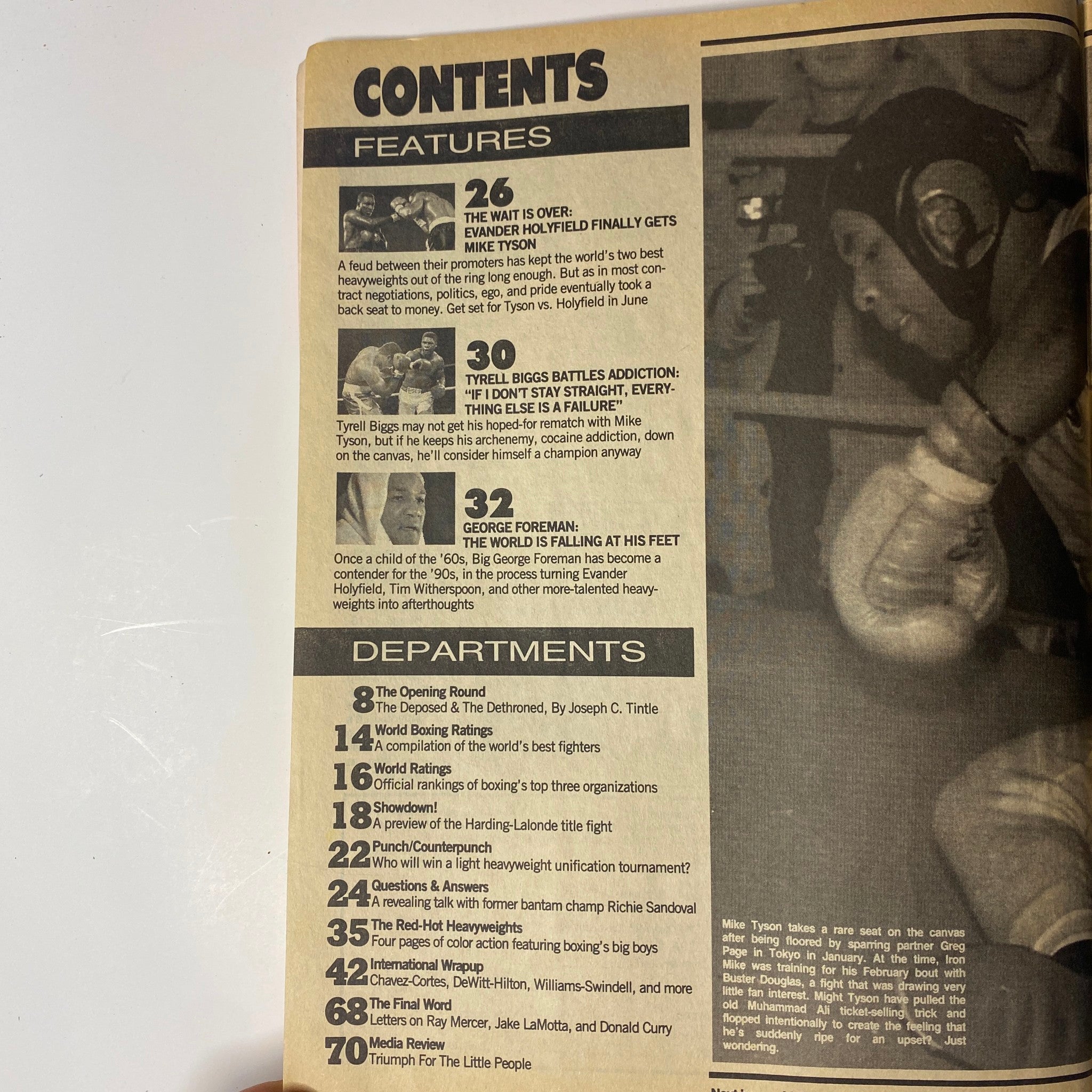 Contents page of World Boxing Magazine June 1990, highlighting features including 'The Wait Is Over: Evander Holyfield Finally Gets Mike Tyson' and 'Tyrell Biggs Battles Addiction'.