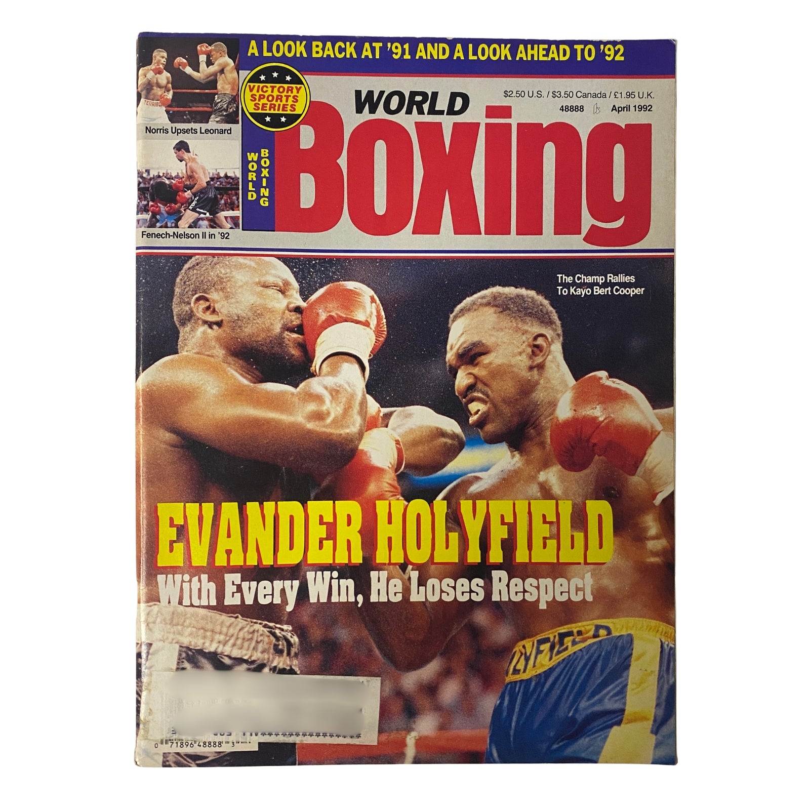 World Boxing Magazine April 1992 featuring Evander Holyfield and Bert Cooper on the cover, highlighting Holyfield's controversial fight against Cooper and his rising respect among boxing critics.