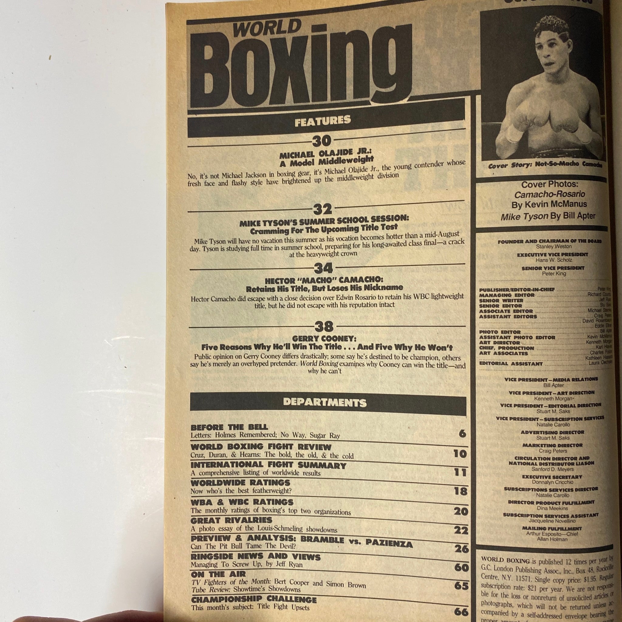 Inside spread of World Boxing Magazine October 1986 showcasing features like Michael Olajide Jr., Mike Tyson's training, Hector Camacho's title fight recap, and Gerry Cooney's career debate.