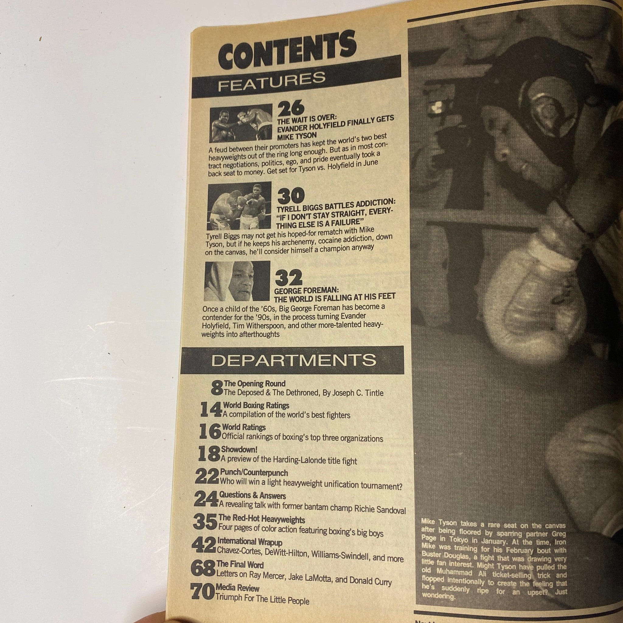 Contents page of World Boxing Magazine June 1990, listing features such as Evander Holyfield vs. Mike Tyson and George Foreman's comeback, showcasing a structured overview of the magazine's content.