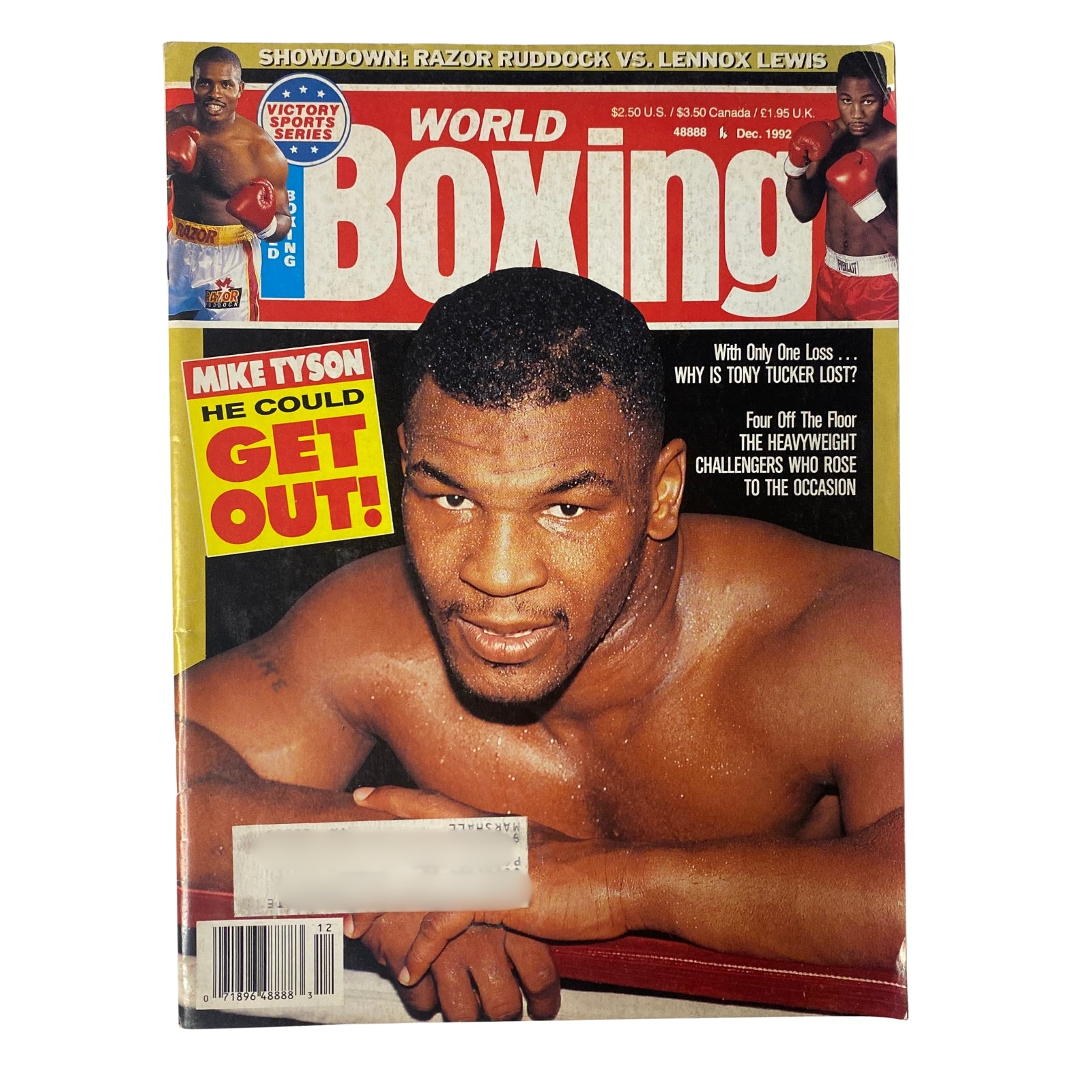 World Boxing Magazine December 1992 cover featuring Mike Tyson with the headline 'He Could Get Out!'. Highlights Razor Ruddock vs. Lennox Lewis showdown.