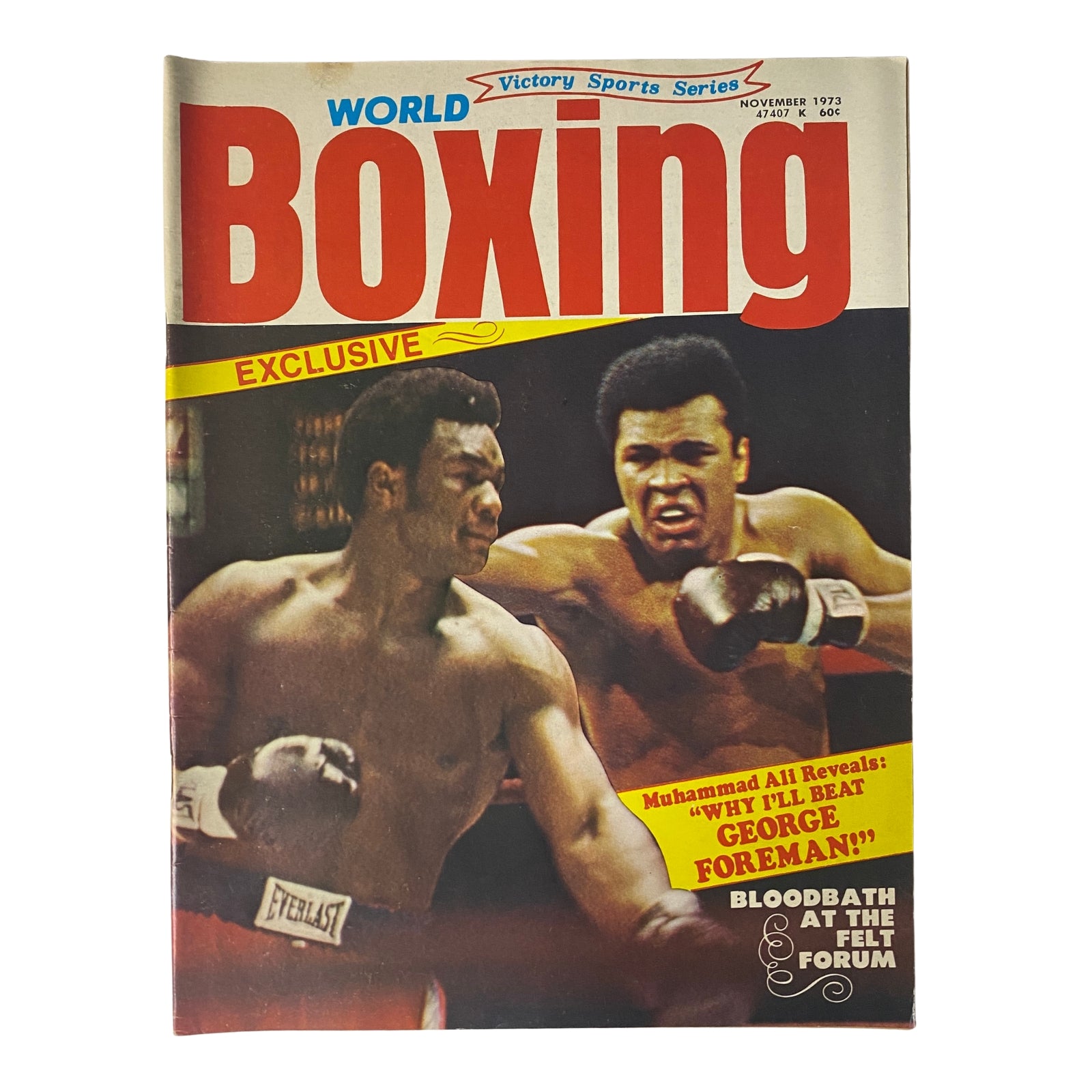 Cover of World Boxing Magazine, November 1973, featuring Muhammad Ali and George Foreman. The title highlights an exclusive interview with Muhammad Ali about defeating George Foreman, along with the article 'Bloodbath at the Felt Forum.' The magazine is in very good condition.