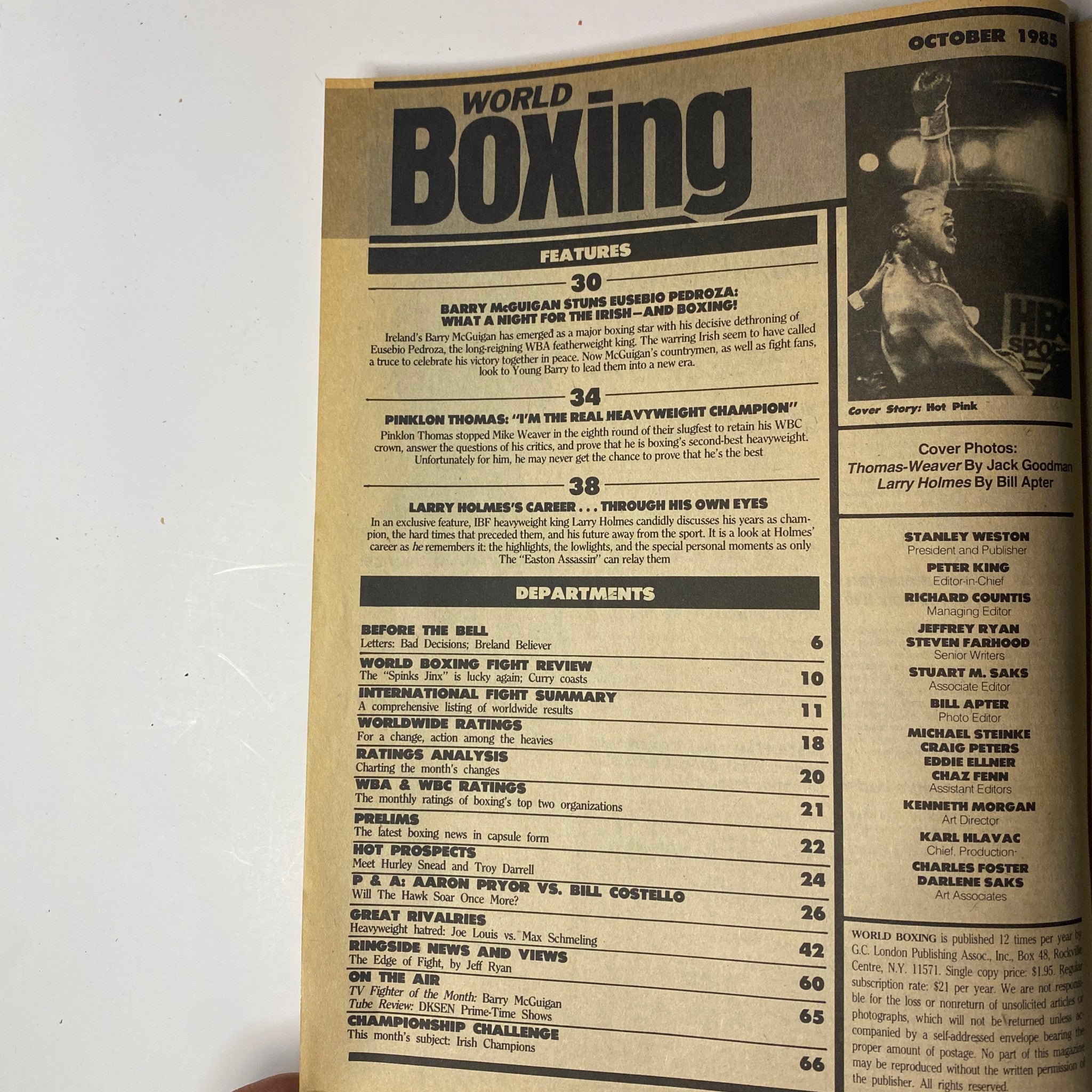 Table of contents from World Boxing Magazine, October 1985, listing features including Barry McGuigan's fight review and Larry Holmes's career retrospective.
