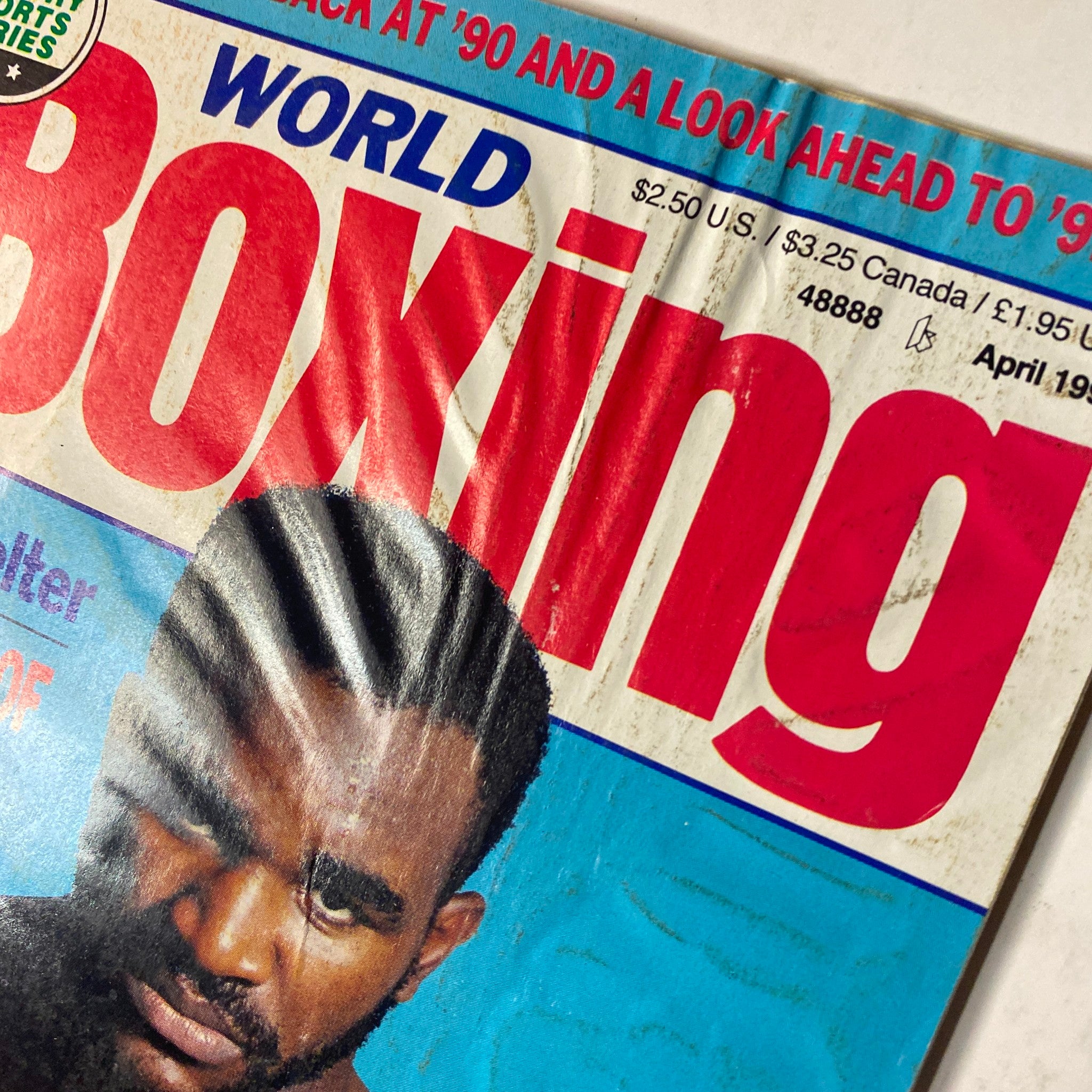 Close-up of World Boxing Magazine April 1991 cover highlighting the title and Evander Holyfield's feature article on his inner strength.