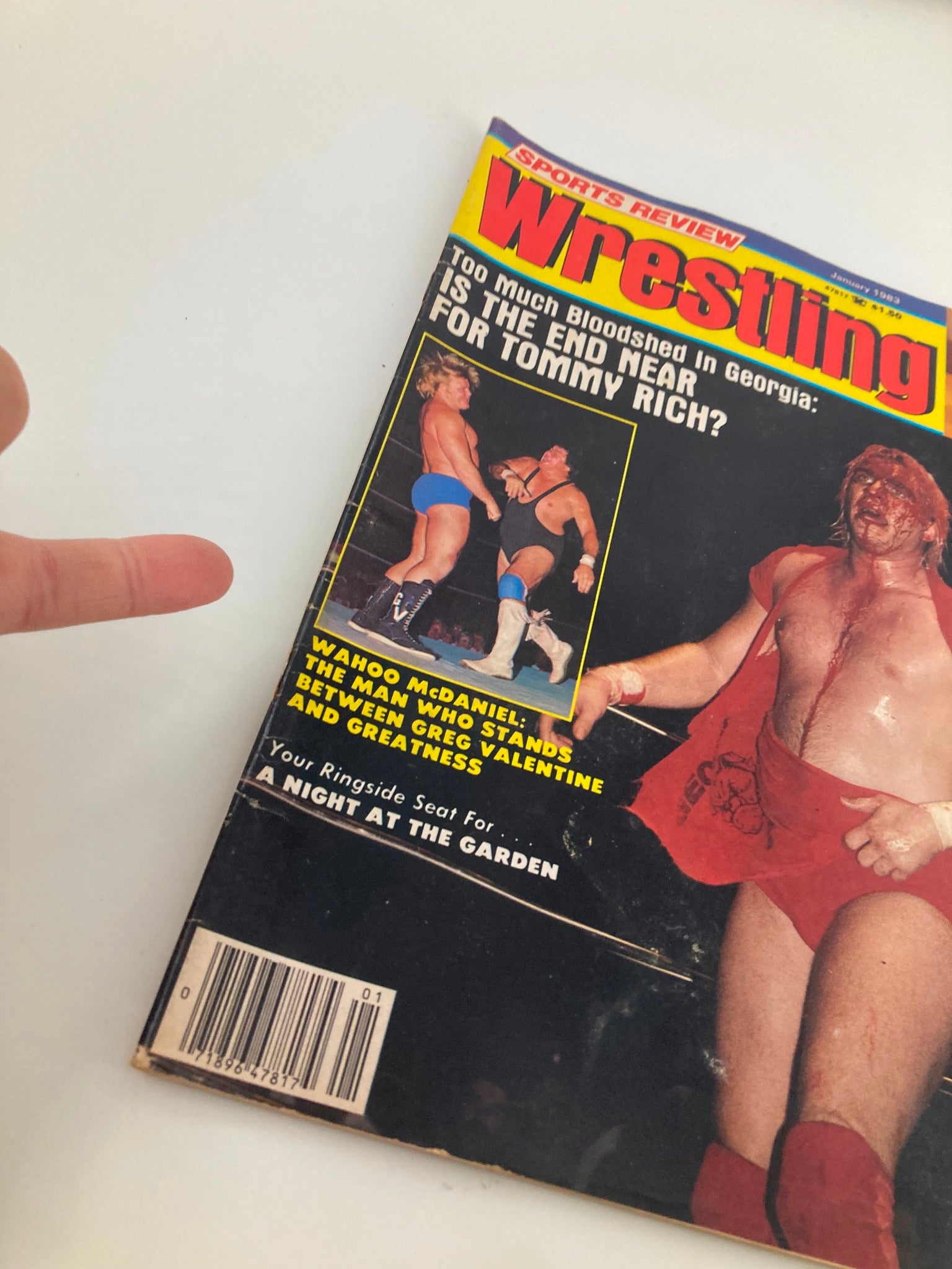 Cover of the VTG Sports Review Wrestling Magazine January 1983 featuring Tommy Rich and Greg Valentine, showcasing wrestling action and a bold title asking, 'Is the End Near for Tommy Rich?'.