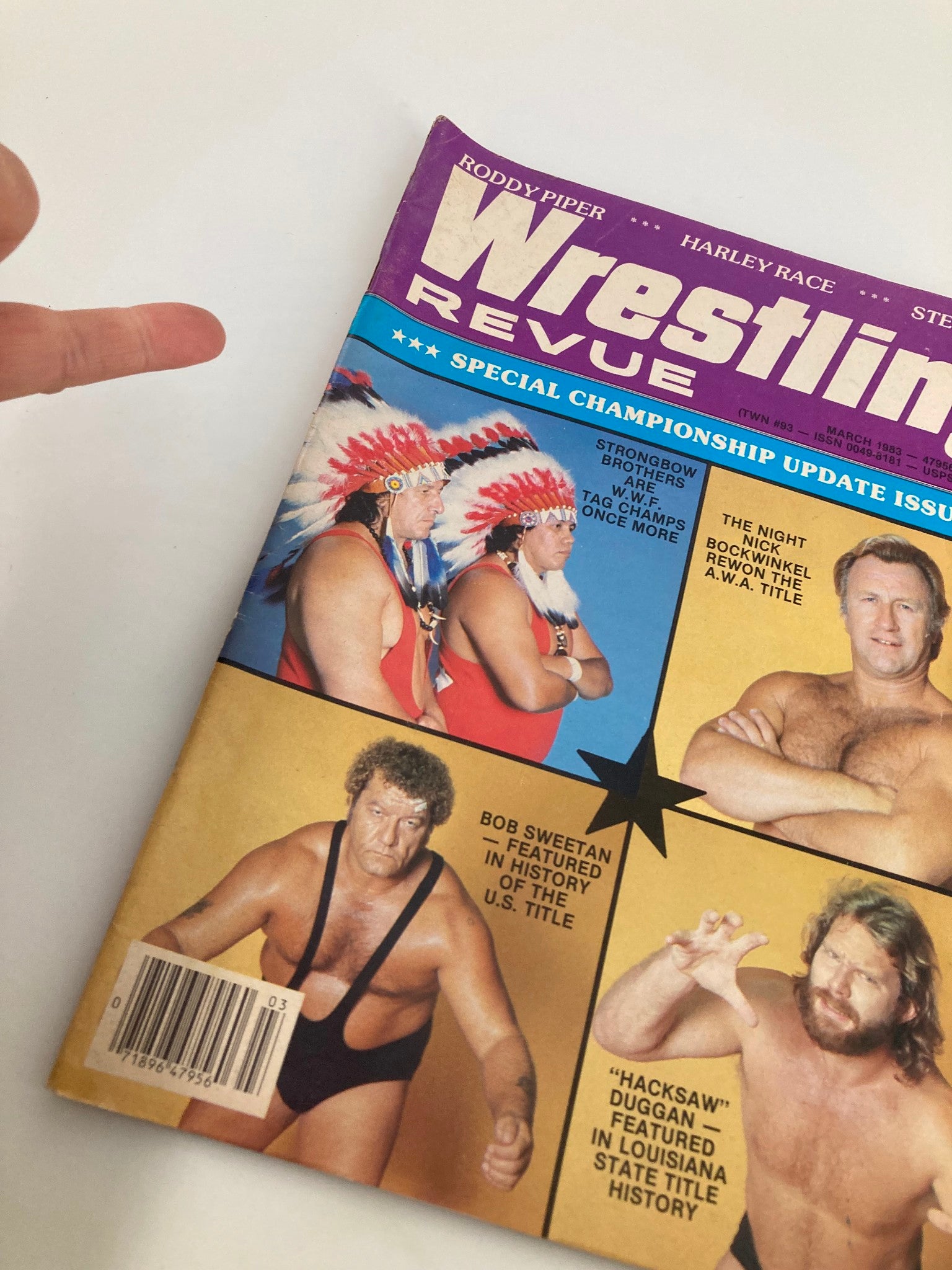 Close-up of the VTG Wrestling Revue Magazine March 1983 cover highlighting the Strongbow Brothers and Nick Bockwinkel, emphasizing its collectible nature and wrestling culture.